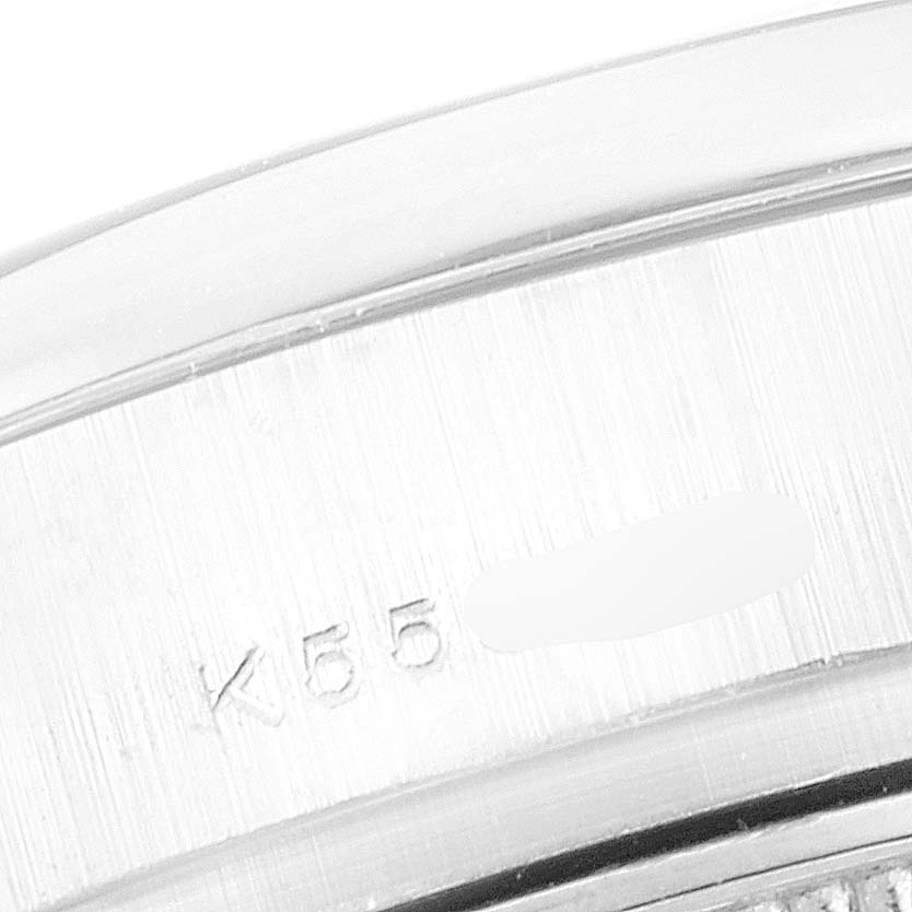 The image shows a close-up view of the caseback edge of a Rolex President 179166 Women's Platinum Silver Dial 179166 Women's Platinum Silver Dial model watch, featuring part of the serial number.