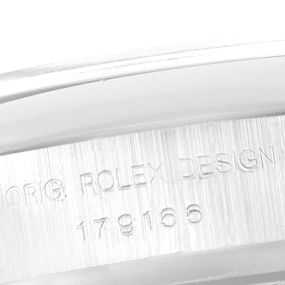 This close-up image shows the serial number and "Orig. Rolex Design" engraving on the President model by Rolex.