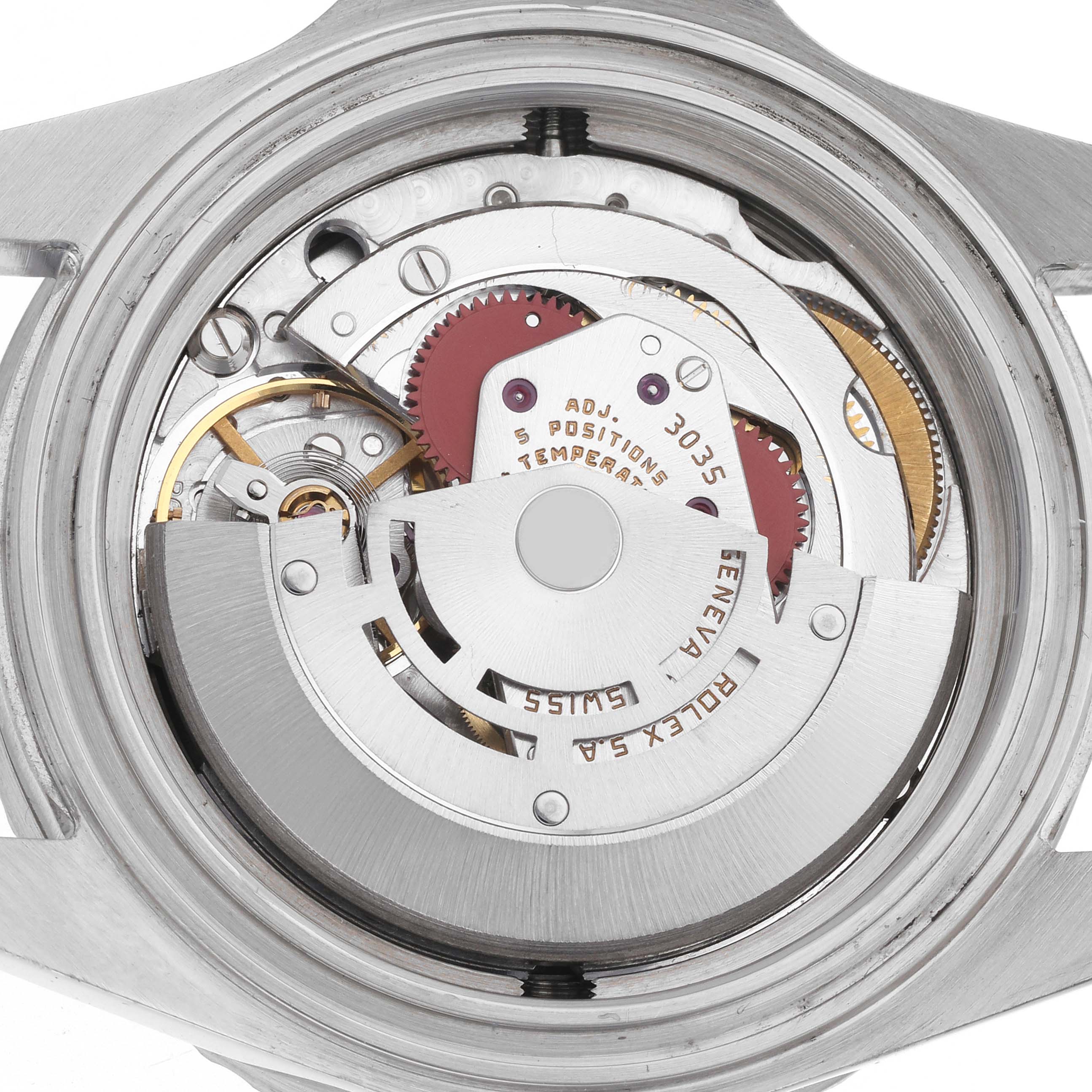 The image shows a close-up of the movement inside a Rolex Sea-Dweller 16660 Men
s Stainless Steel Black Dial 16660 Men
s Stainless Steel Black Dial watch from a back view, highlighting gears and mechanics.