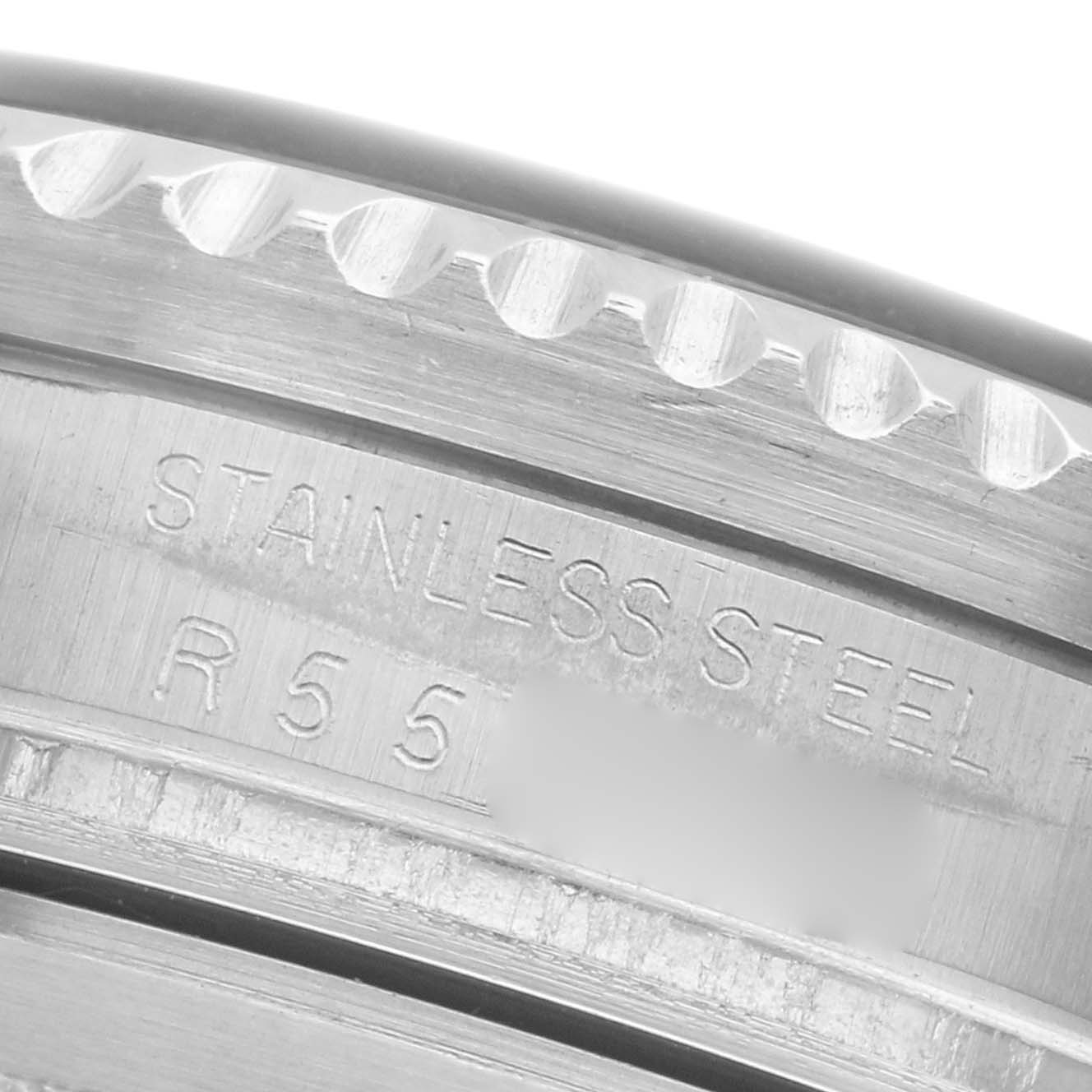 The image shows a close-up of the inner engraving on the stainless steel bezel of a Rolex Sea-Dweller 16660 Men
s Stainless Steel Black Dial 16660 Men
s Stainless Steel Black Dial watch.