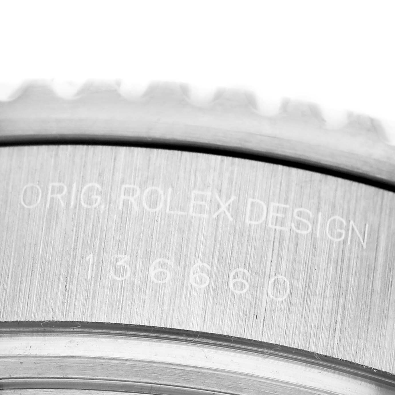 The image shows a close-up of the engraved side of a Rolex Sea-Dweller 136660 Men's Stainless Steel Blue Dial, highlighting the design and model number.