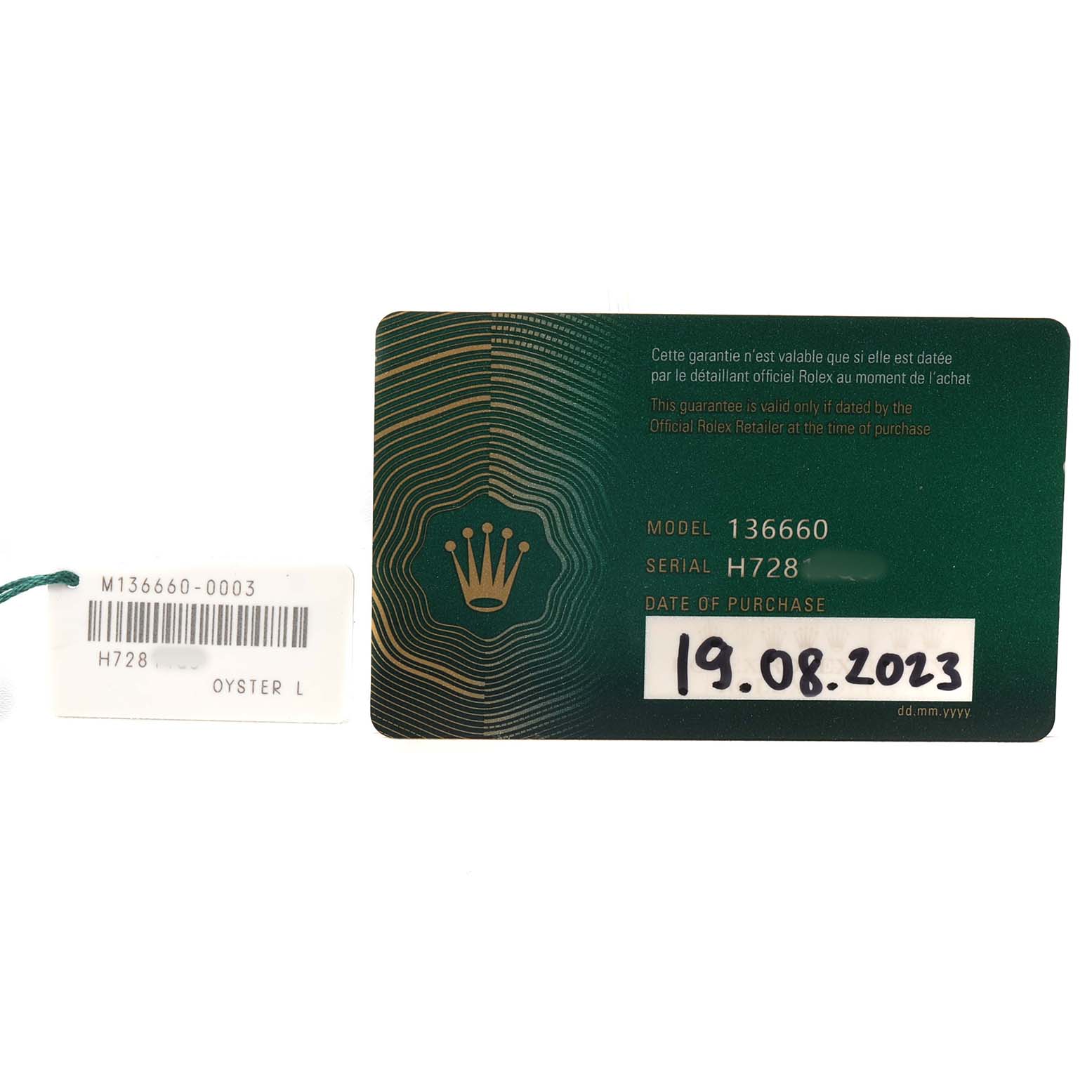 The image shows a Rolex Sea-Dweller 136660 Men's Stainless Steel Blue Dial model 136660 warranty card and tag, displaying the model and purchase date.