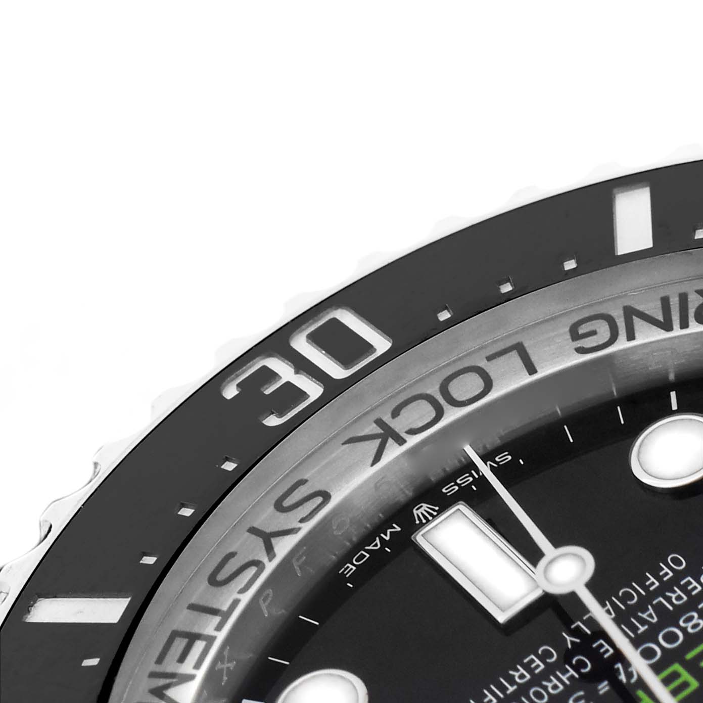 The image shows a close-up of the bezel and part of the dial of a Rolex Sea-Dweller 136660 Men's Stainless Steel Blue Dial, focusing on the "30" marker.