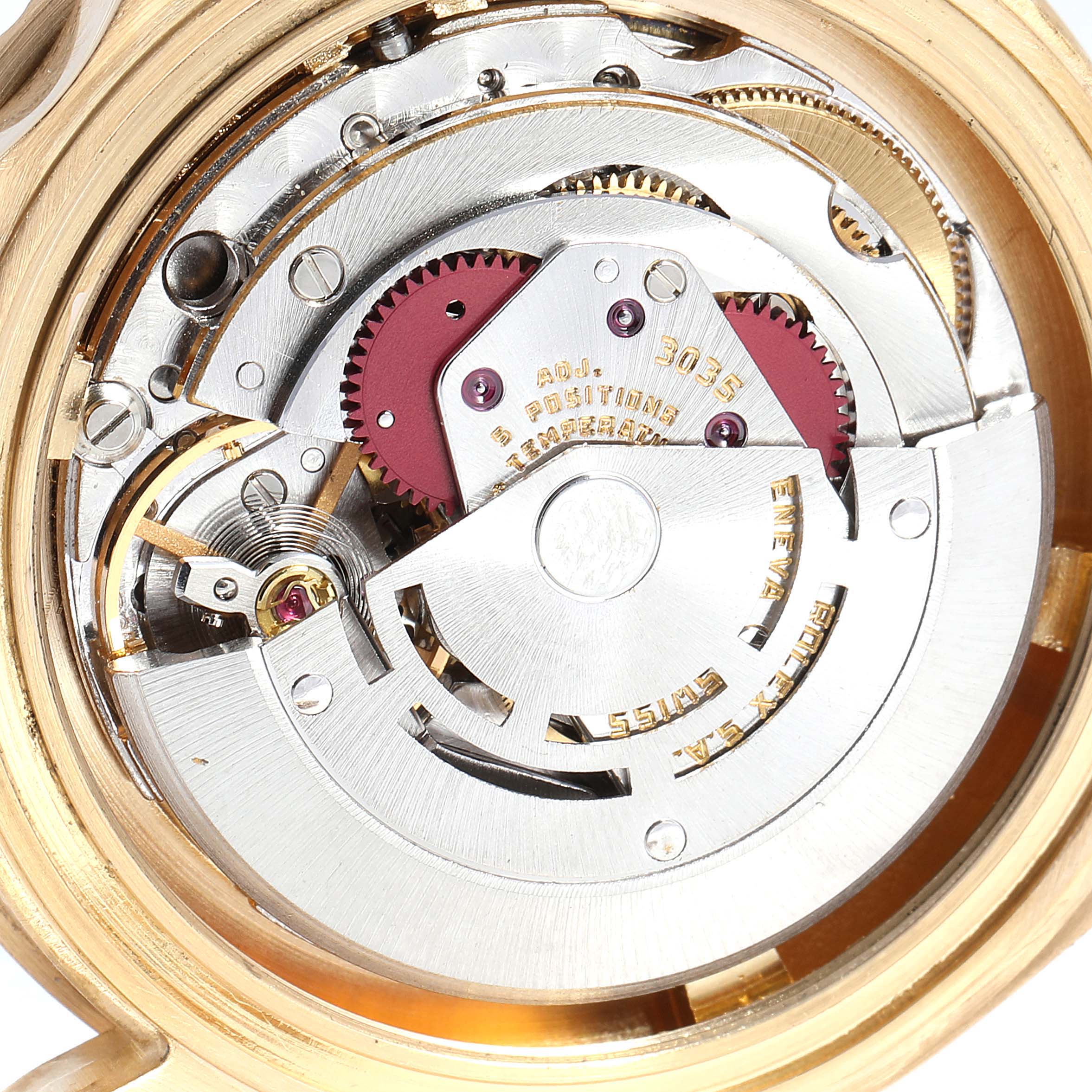 This is a close-up image showing the movement mechanism of a Rolex Submariner 16808 Men
s Yellow Gold Blue Dial 16808 Men
s Yellow Gold Blue Dial watch from the back view.