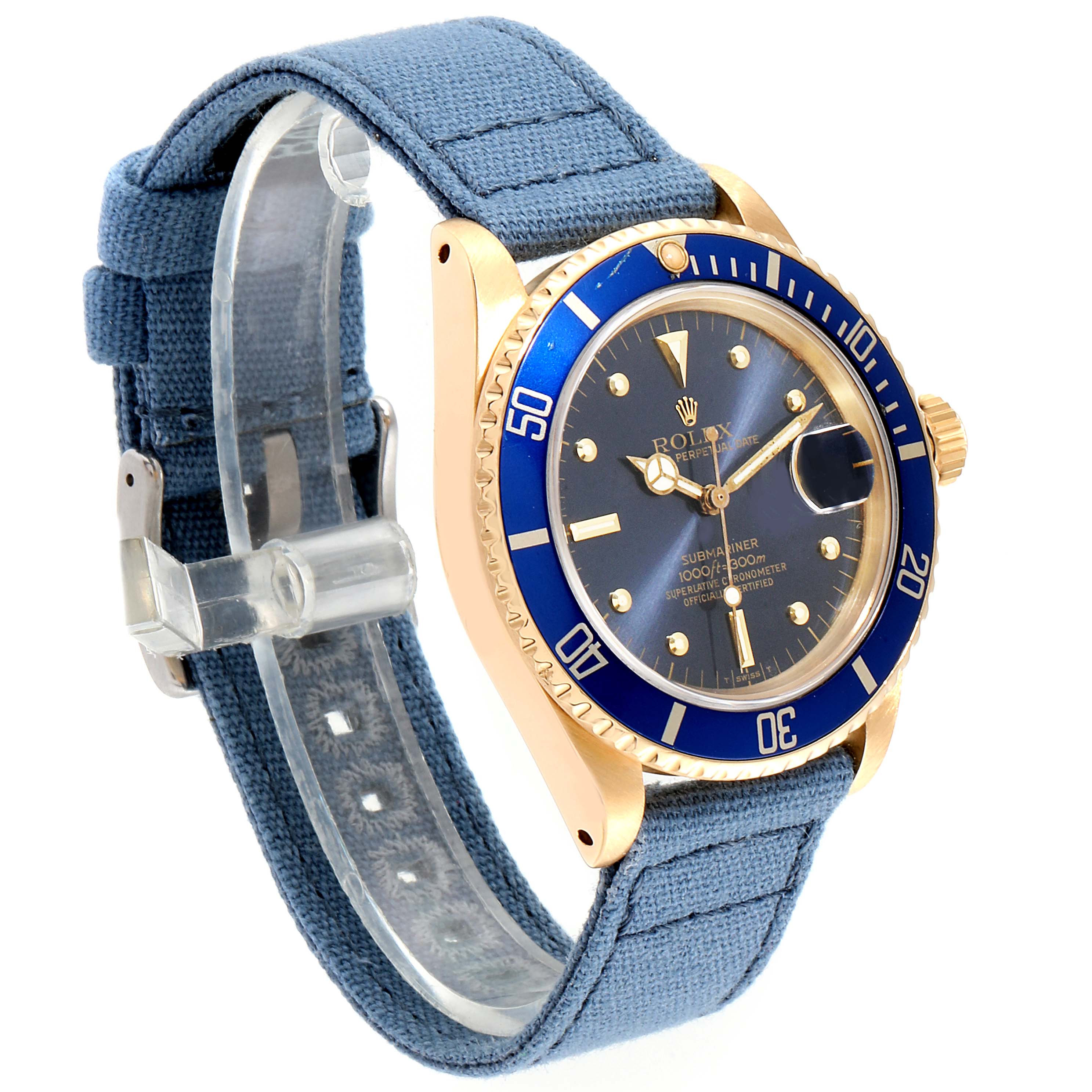 The image shows a Rolex Submariner 16808 Men
s Yellow Gold Blue Dial 16808 Men
s Yellow Gold Blue Dial watch at a slight angle, displaying its face, bezel, case, and fabric strap.