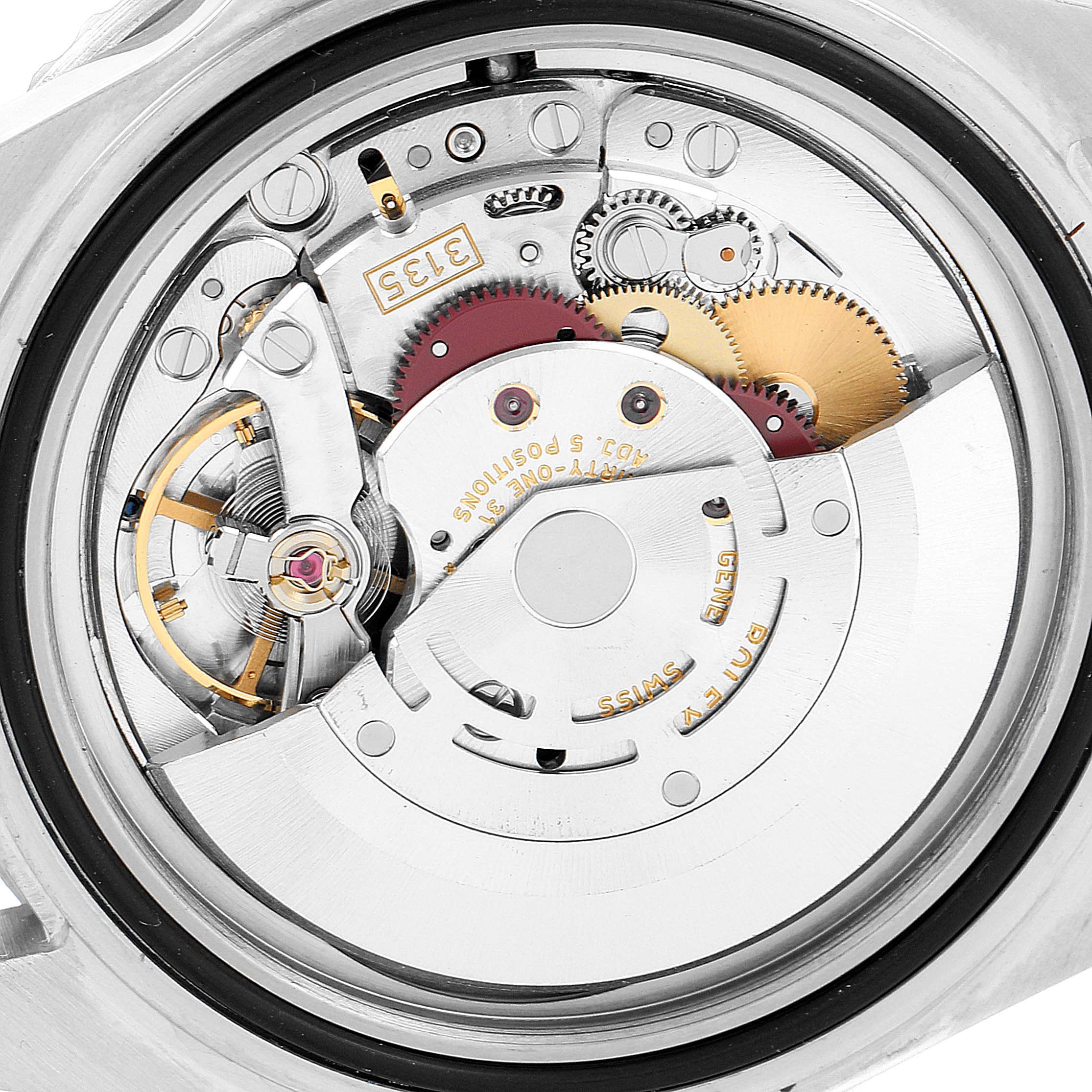 The image shows the internal mechanism of a Rolex Submariner 16610 Men
s Stainless Steel Black Dial 16610 Men
s Stainless Steel Black Dial watch, highlighting gears, rotor, and various intricate components.