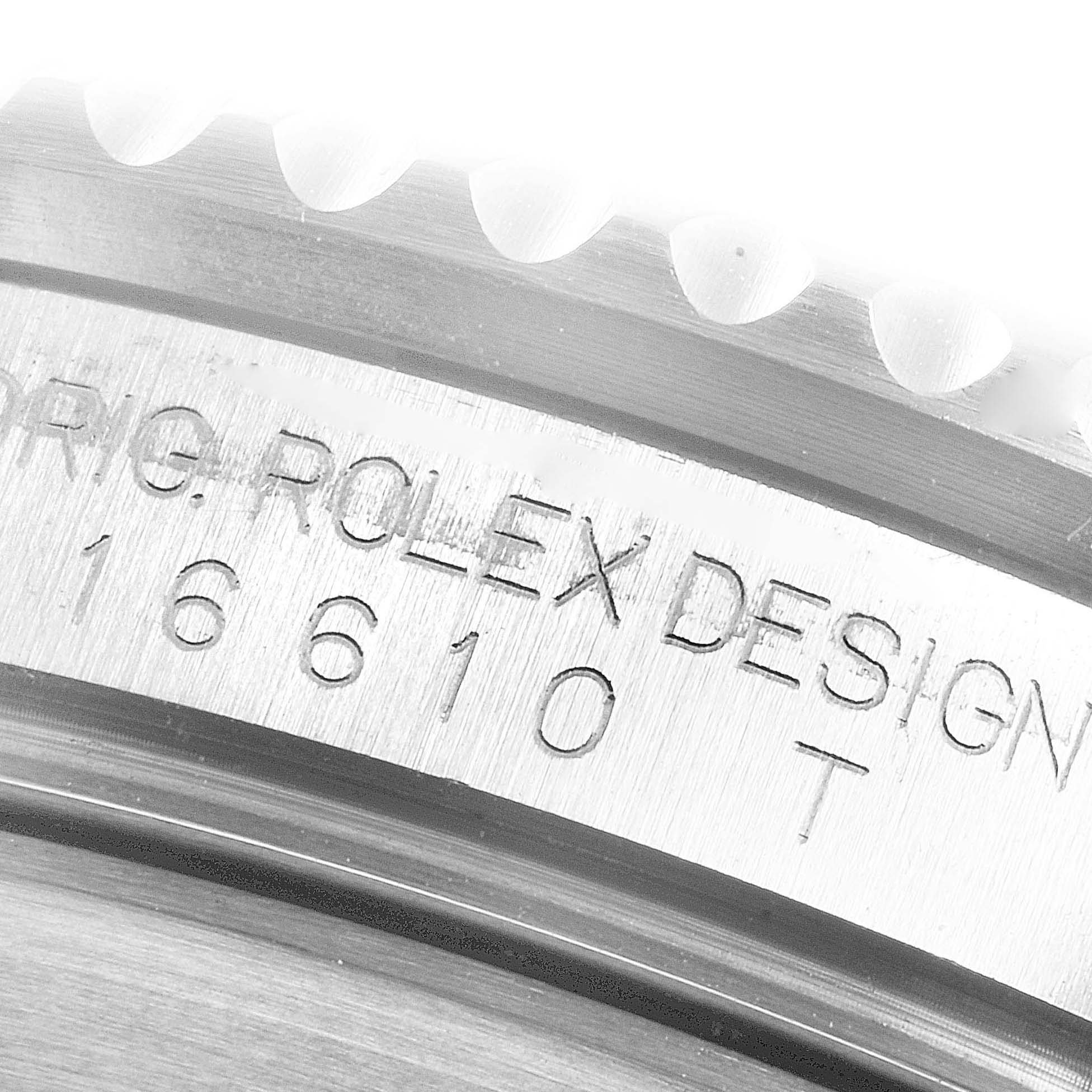 This image shows a close-up of the engraved model number and part of the bezel of a Rolex Submariner 16610 Men
s Stainless Steel Black Dial 16610 Men
s Stainless Steel Black Dial watch.