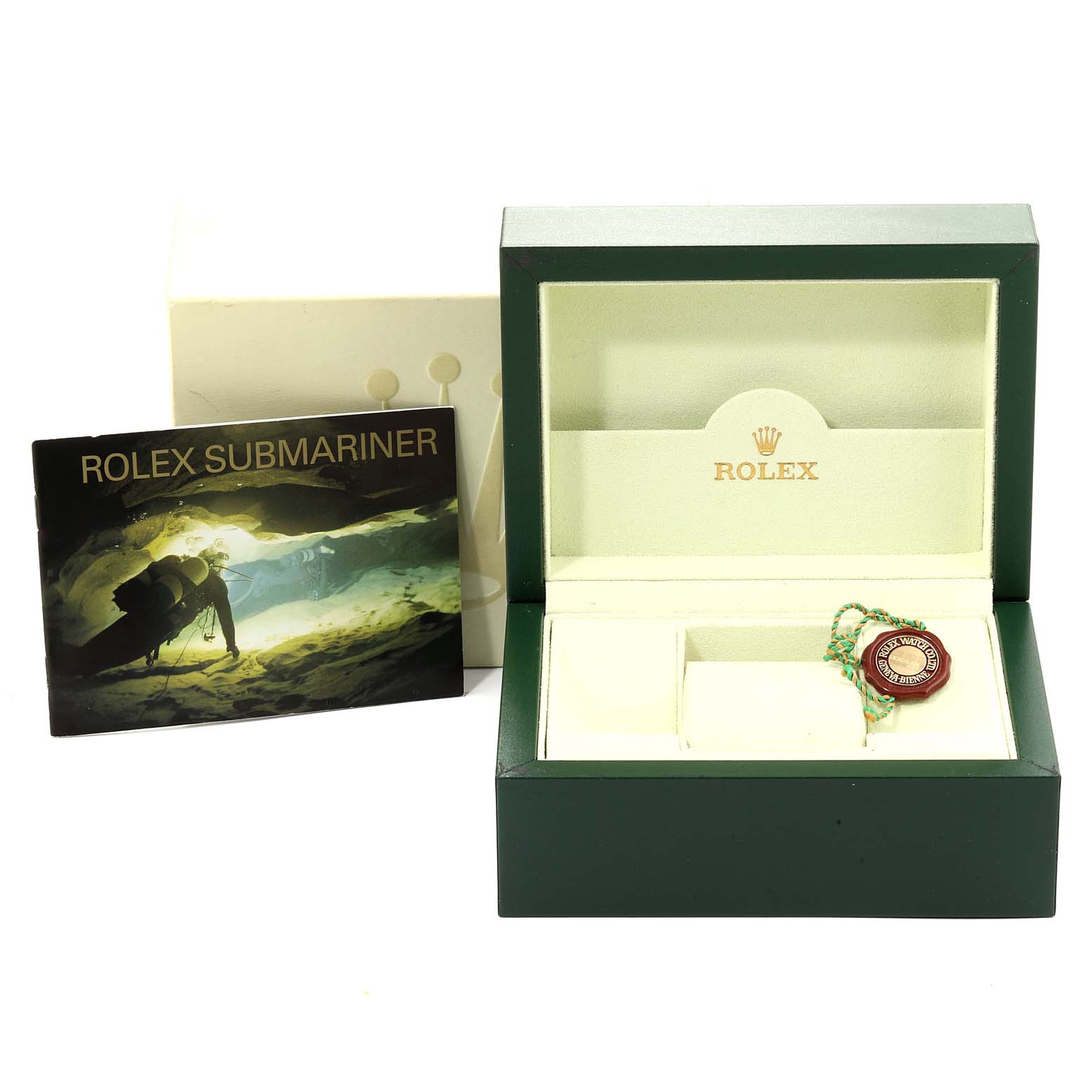 The image shows the open box, booklet, and tag of a Rolex Submariner 16610 Men
s Stainless Steel Black Dial 16610 Men
s Stainless Steel Black Dial model watch.