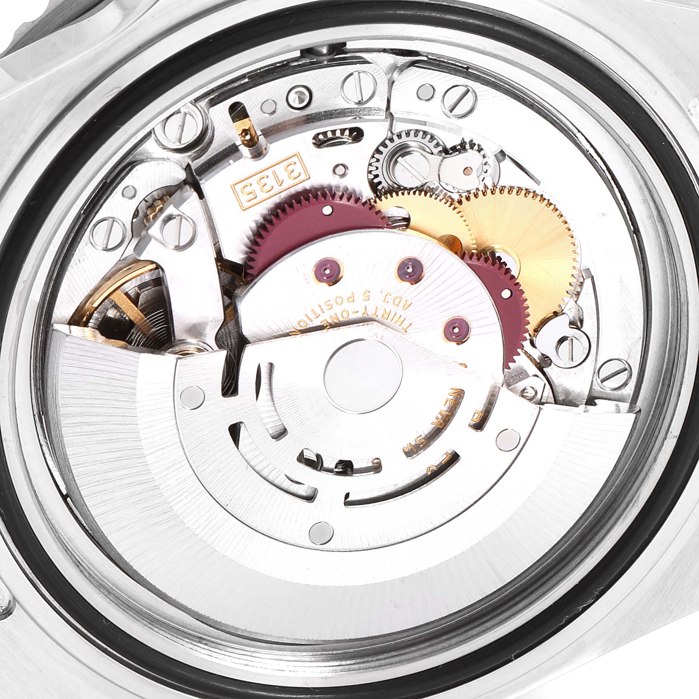 This image shows the internal mechanism of a Rolex Submariner 16610 Men
s Stainless Steel Black Dial 16610 Men
s Stainless Steel Black Dial watch, viewed from the back with parts including gears and the rotor.
