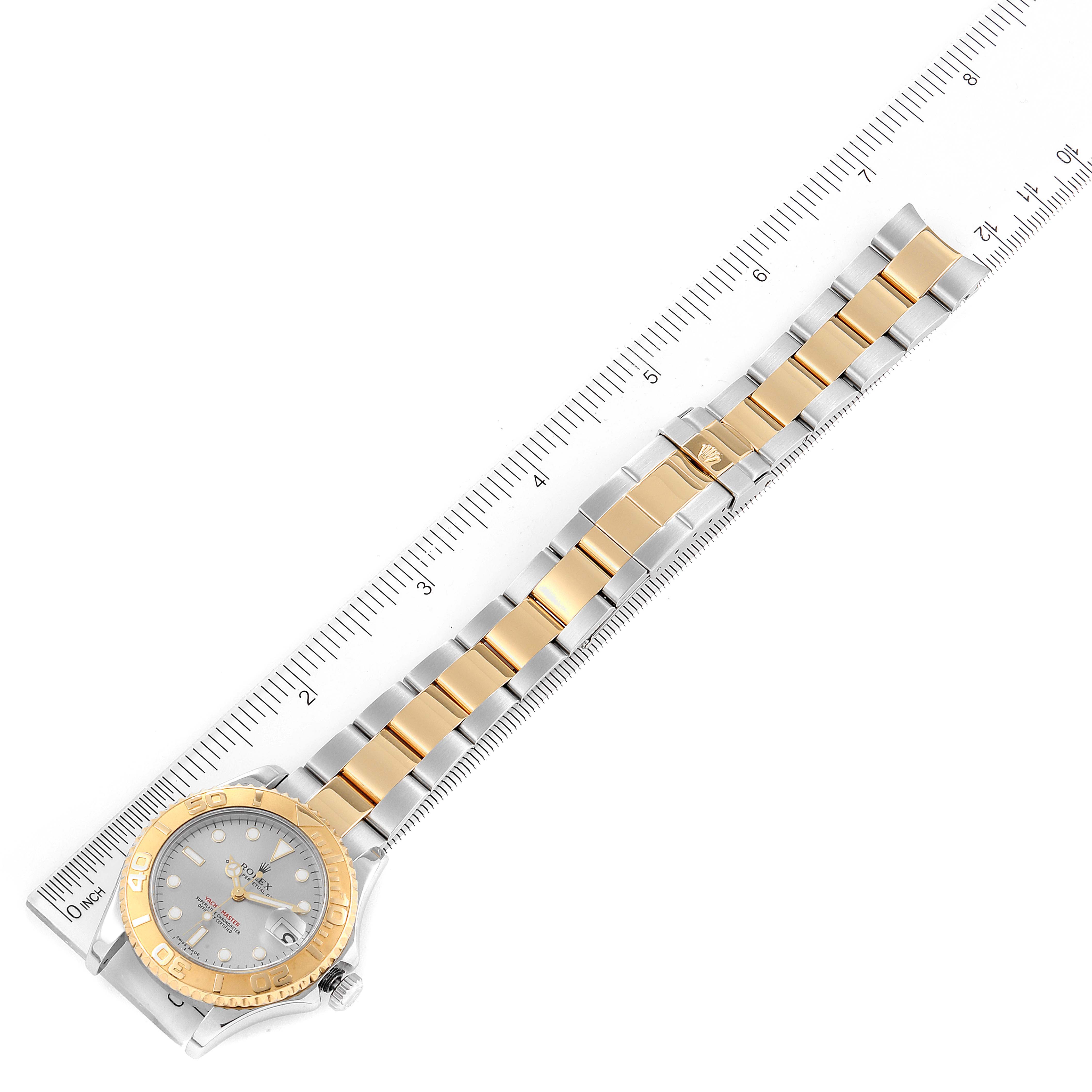 The image shows a Rolex Yacht-Master 168623 Men
s Steel and Gold (two tone) Grey Dial 168623 Men
s Steel and Gold (two tone) Grey Dial watch, laid flat with the full bracelet visible and measured by a ruler.
