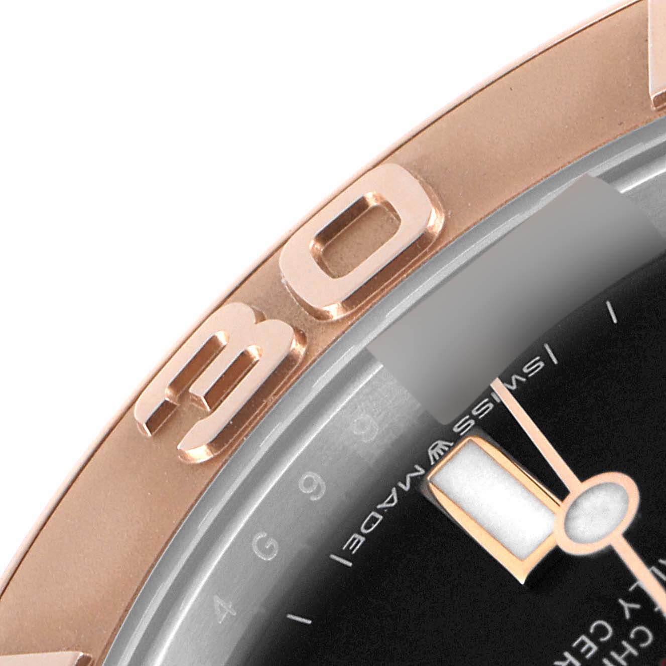 This close-up shows the bezel and a section of the dial of the Rolex Yacht-Master 268621 Men
s Steel and Gold (two tone) Black Dial 268621 Men
s Steel and Gold (two tone) Black Dial watch.