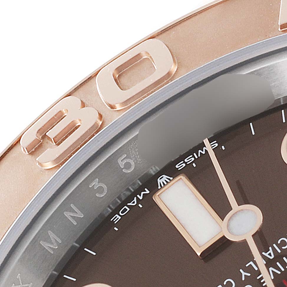 This image shows a close-up of the bezel and partial dial of a Rolex Yacht-Master 126621 Men's Steel and Gold (two tone) Brown Dial 126621 Men's Steel and Gold (two tone) Brown Dial watch.