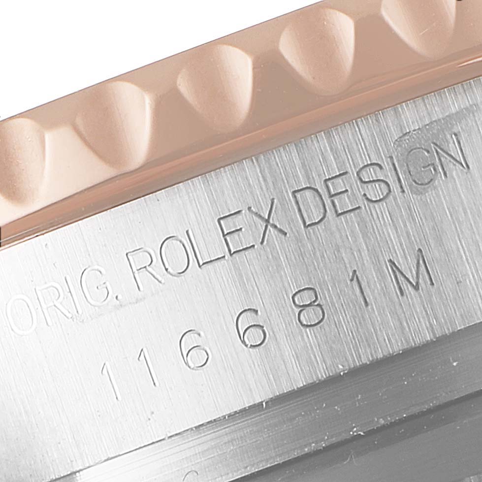 The image shows a close-up of the engraved model number and Rolex branding on the bezel of a Rolex Yacht-Master 116681 Men
s Steel and Gold (two tone) White Dial 116681 Men
s Steel and Gold (two tone) White Dial watch.