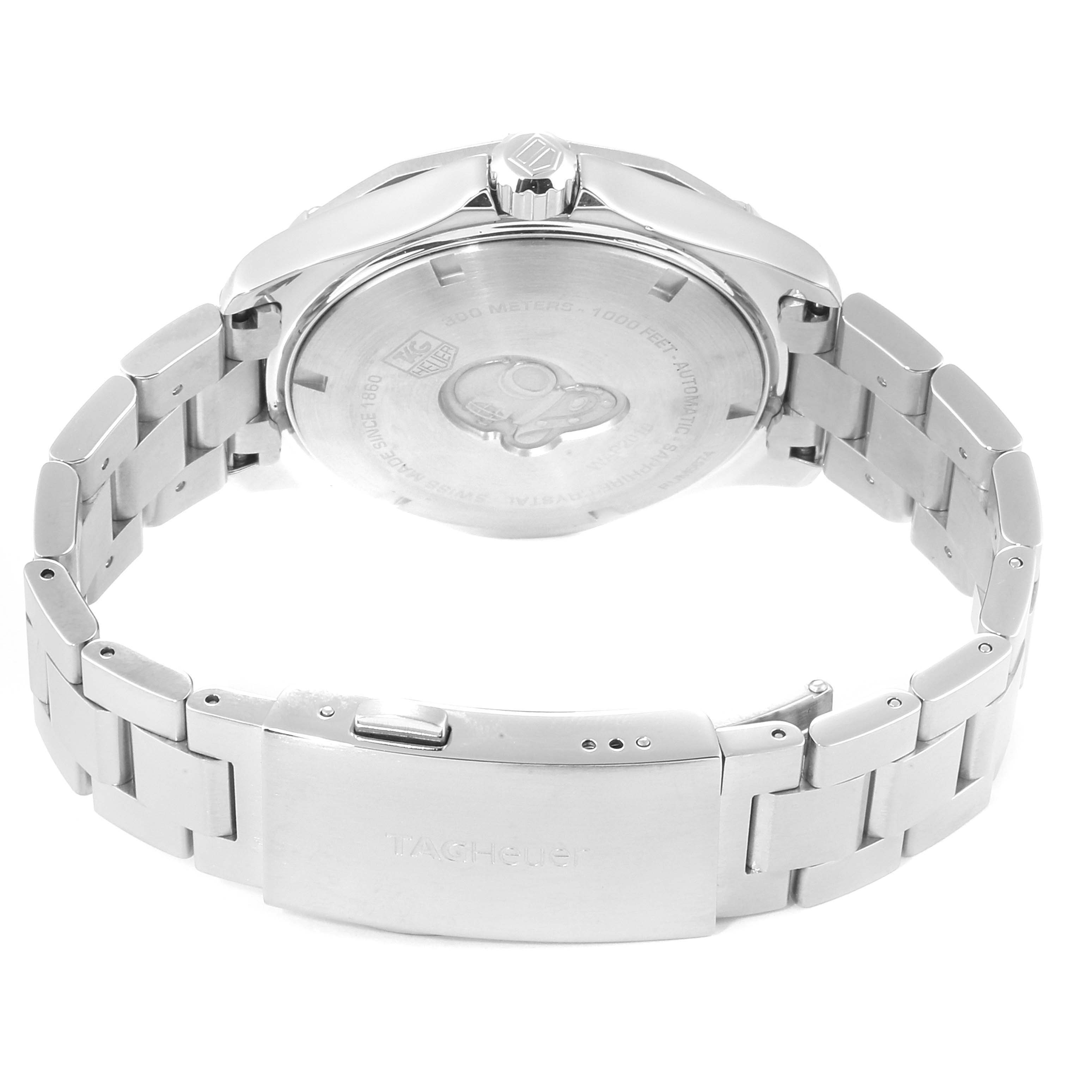 The image shows the Tag Heuer Aquaracer WAY2110.BA0928 Men
s Stainless Steel Black Dial WAY2110.BA0928 Men
s Stainless Steel Black Dial watch from a rear angle, displaying the case back and part of the metal bracelet.