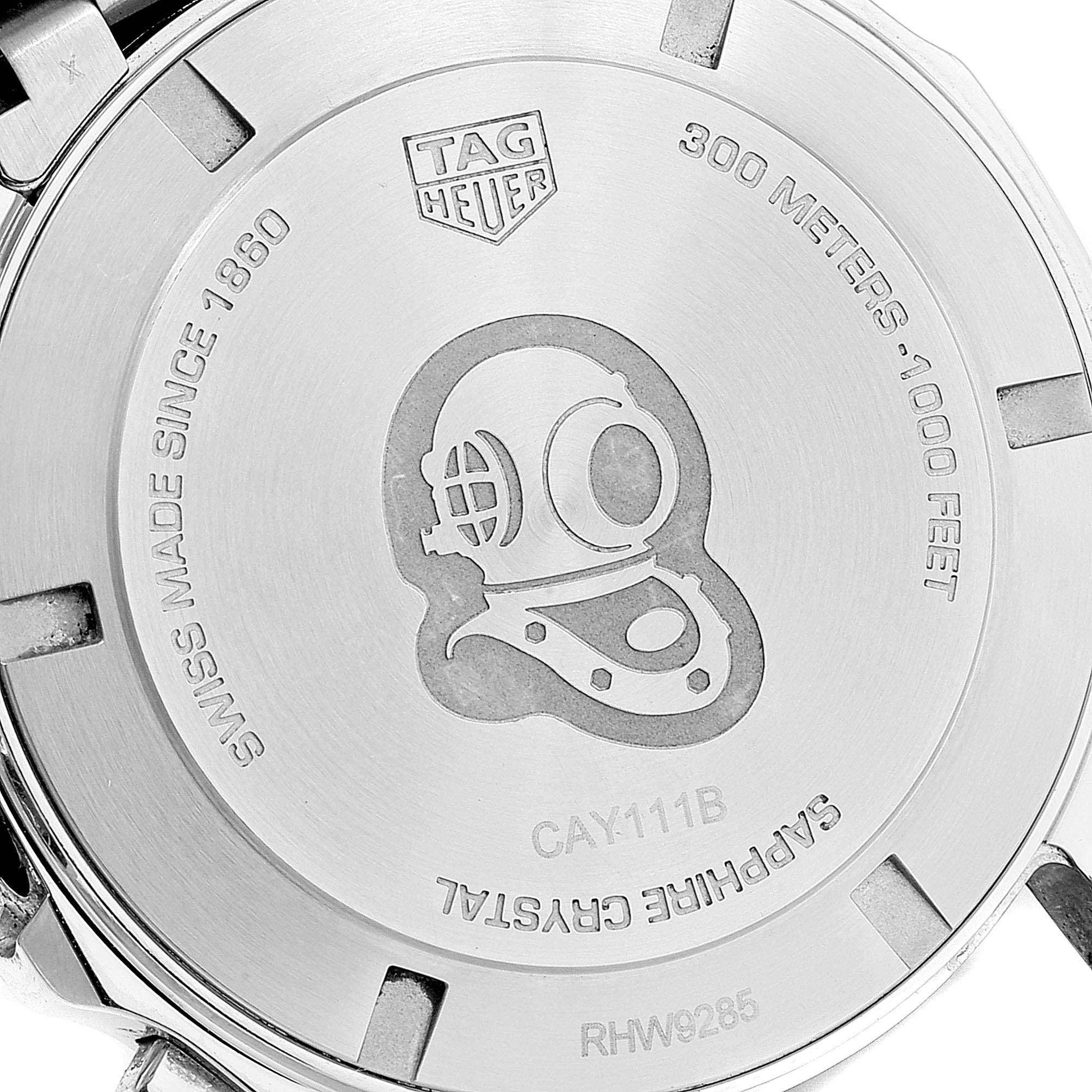 The image shows the back casing of a Tag Heuer Aquaracer CAY111B.BA0927 Men
s Stainless Steel Blue Dial CAY111B.BA0927 Men
s Stainless Steel Blue Dial watch, featuring detailing like the brand logo and specifications.