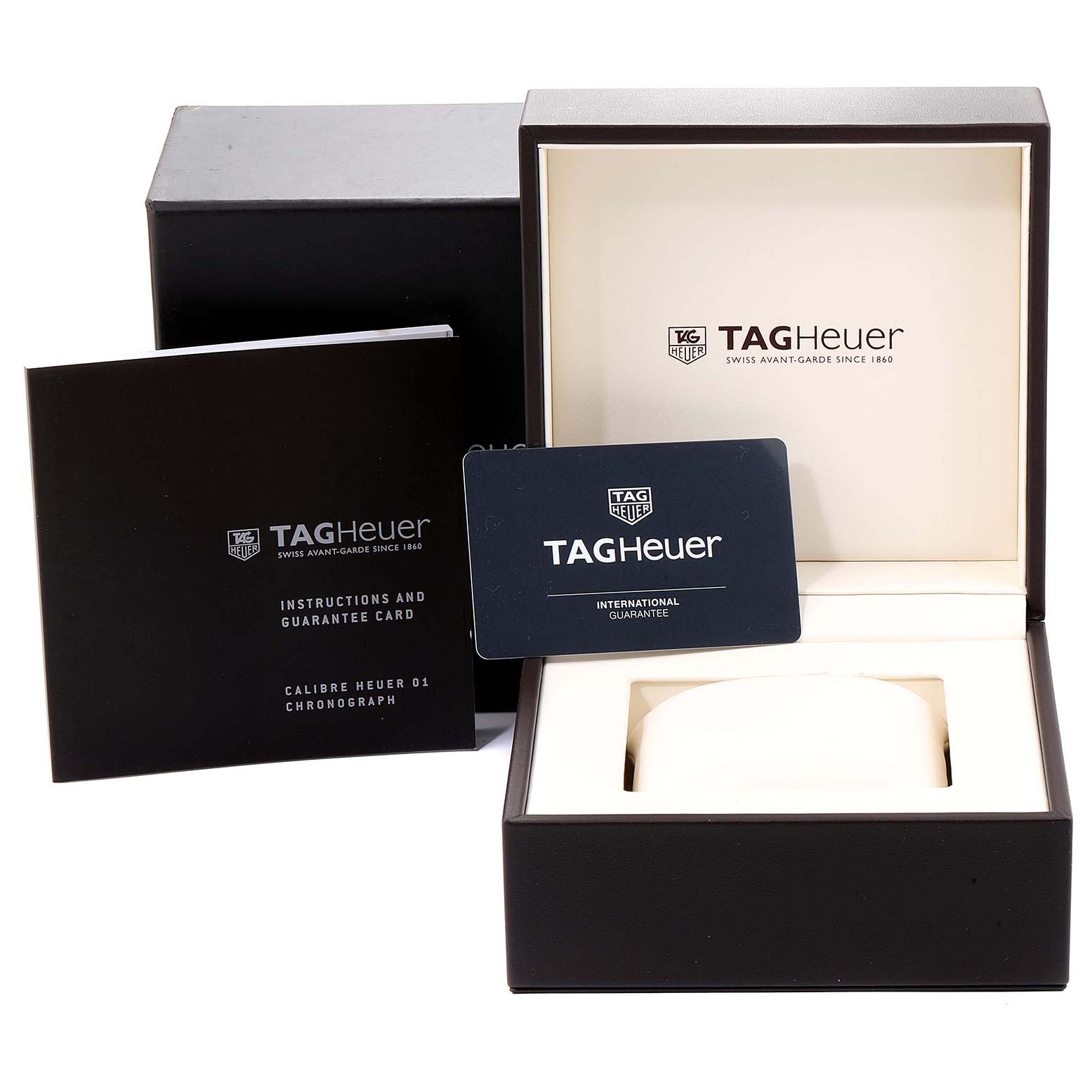 The image shows the packaging, instruction manual, and guarantee card for a Tag Heuer Carrera CAR2A1W.BA0703 Men's Stainless Steel Transparent Dial CAR2A1W.BA0703 Men's Stainless Steel Transparent Dial watch.