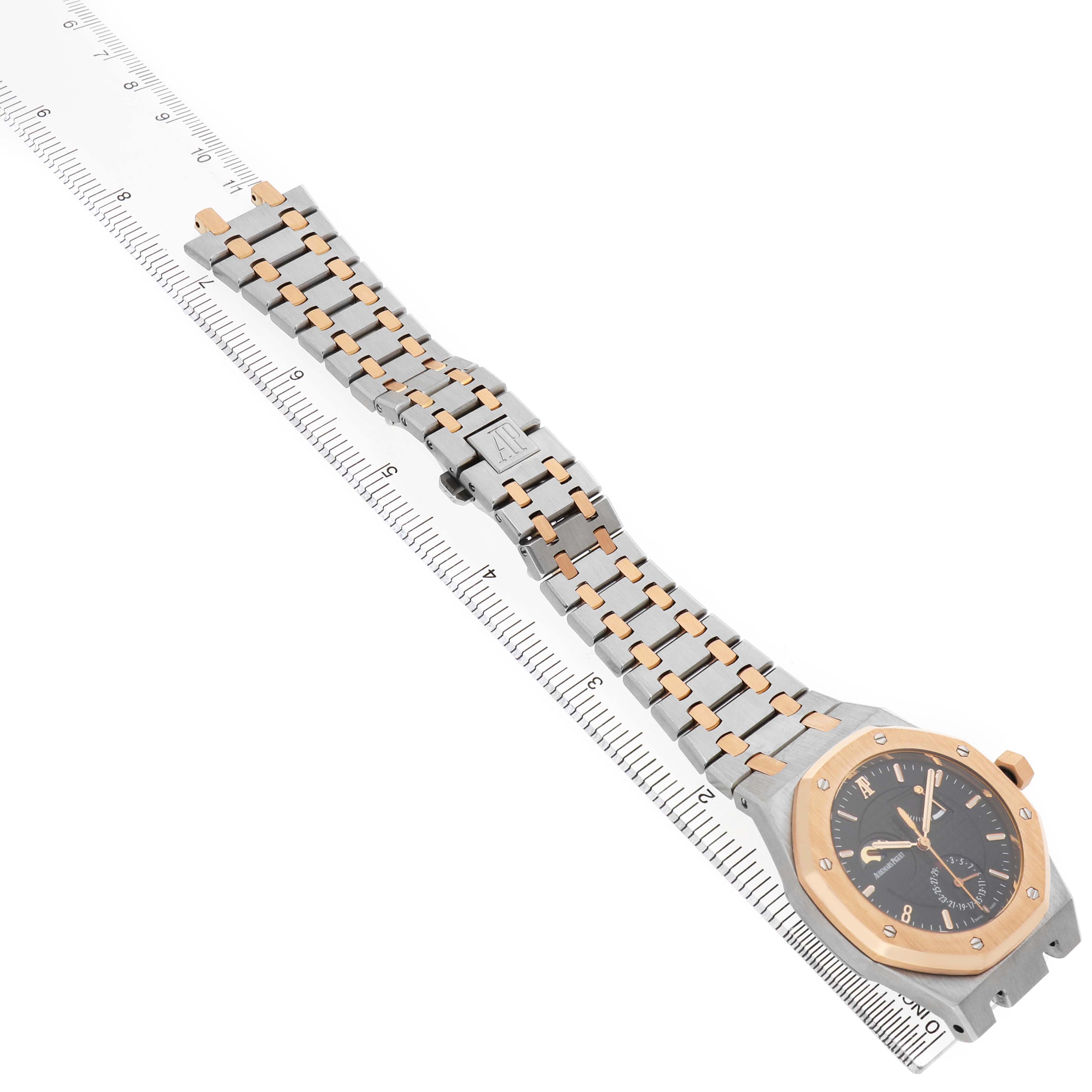 The Audemars Piguet Royal Oak 26168SR Men's Steel and Gold (two tone) Black Dial watch is shown at an angle with a view of the full bracelet and the watch face.