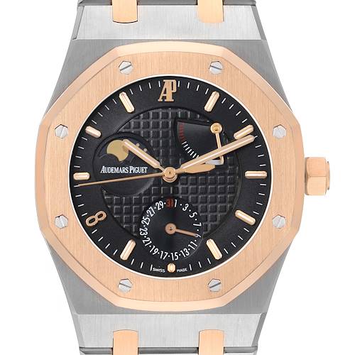 The Audemars Piguet Royal Oak 26168SR Men's Steel and Gold (two tone) Black Dial watch is shown from a front angle, highlighting its octagonal bezel, black textured dial, and gold hands.