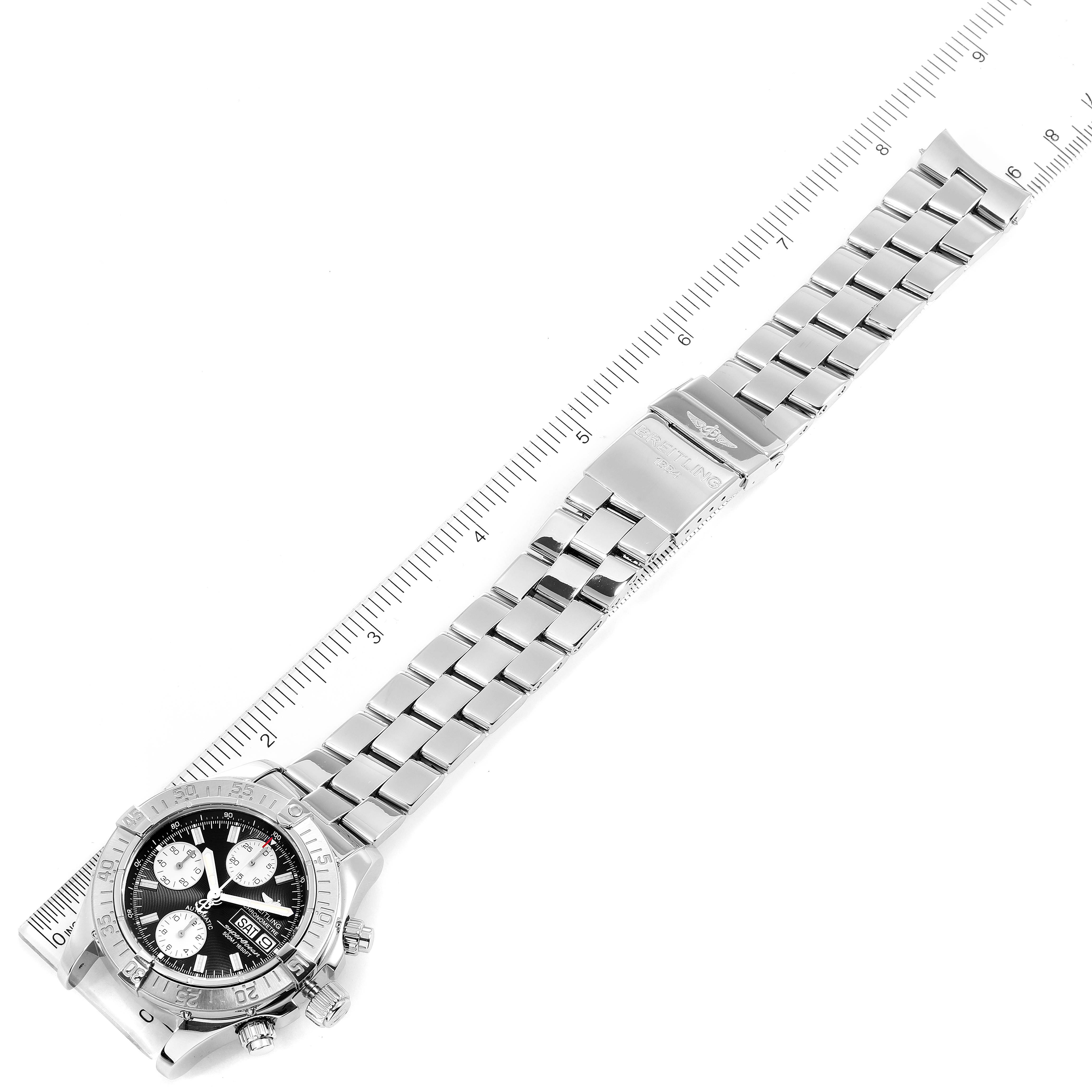 This image shows the Breitling Superocean A13340 Men
s Stainless Steel Black Dial A13340 Men
s Stainless Steel Black Dial watch at an overhead angle, focusing on the strap and face.