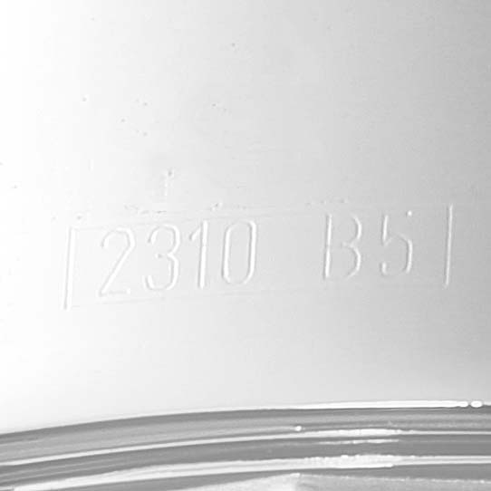 The image shows a close-up of the serial number engraving on the casing of a Breitling Superocean A13340 Men
s Stainless Steel Black Dial A13340 Men
s Stainless Steel Black Dial watch.