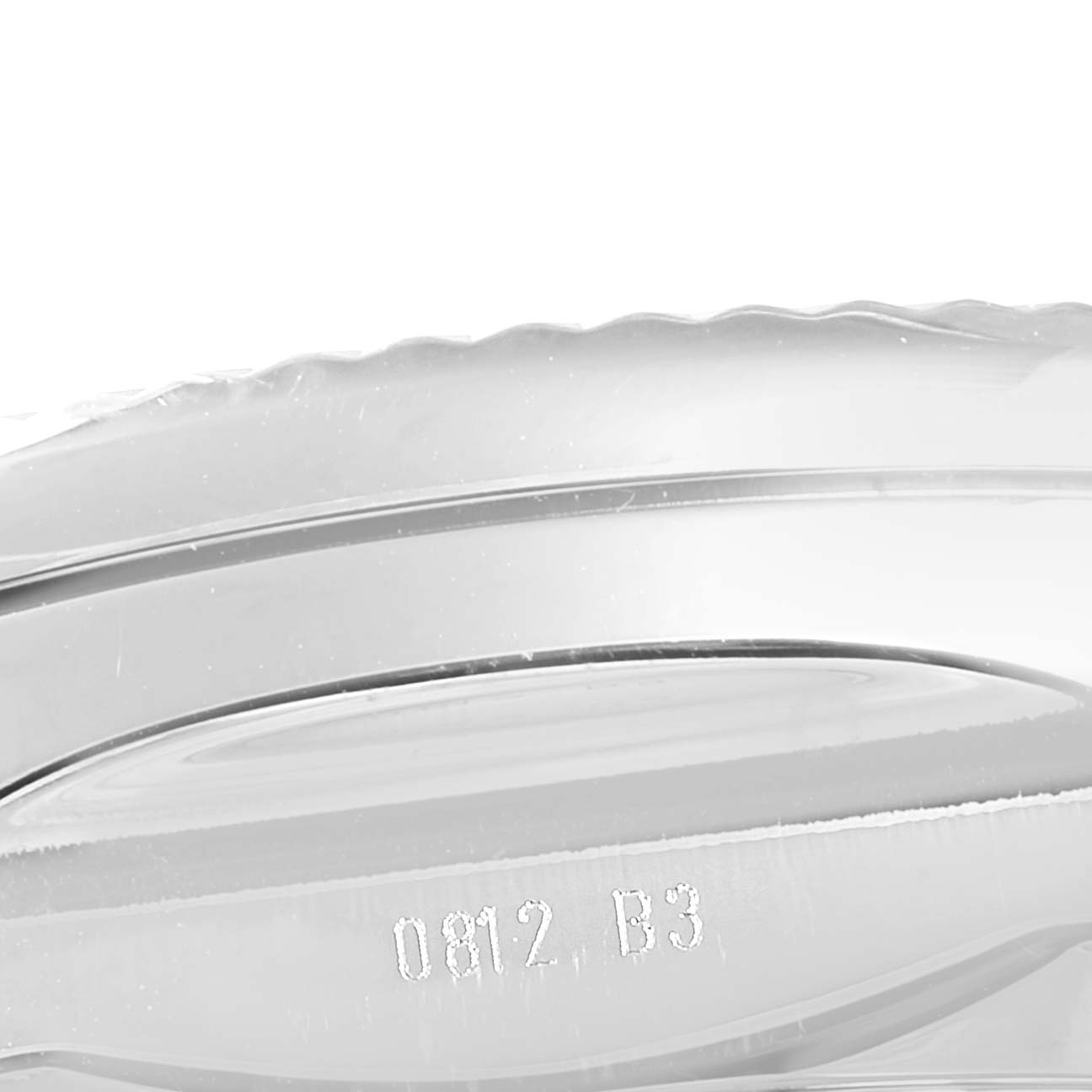 This image shows a close-up of the side bezel of a Bentley model by Breitling.