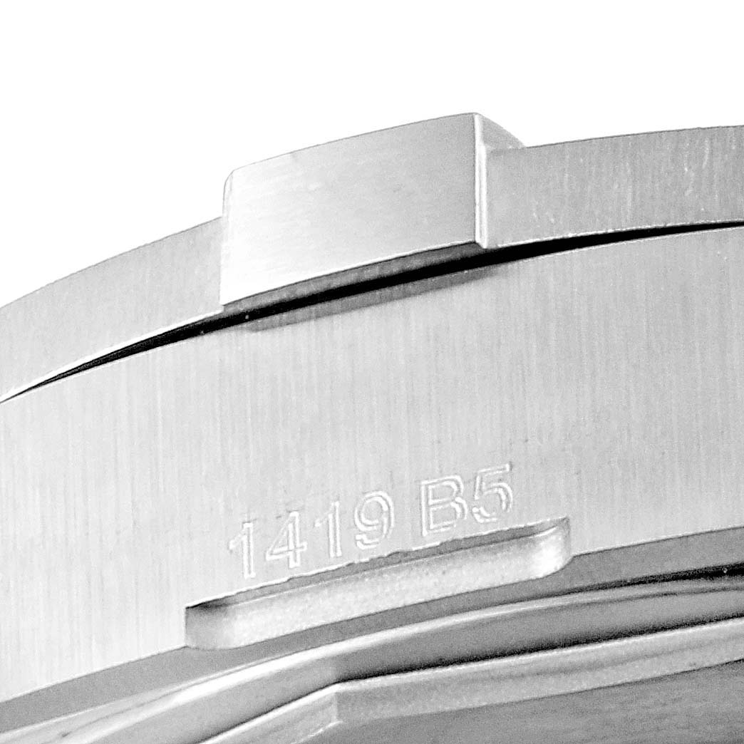 The image shows a close-up angle of the serial number engraving on the Breitling Colt A17313 Men's Stainless Steel Grey Dial A17313 Men's Stainless Steel Grey Dial watch case.