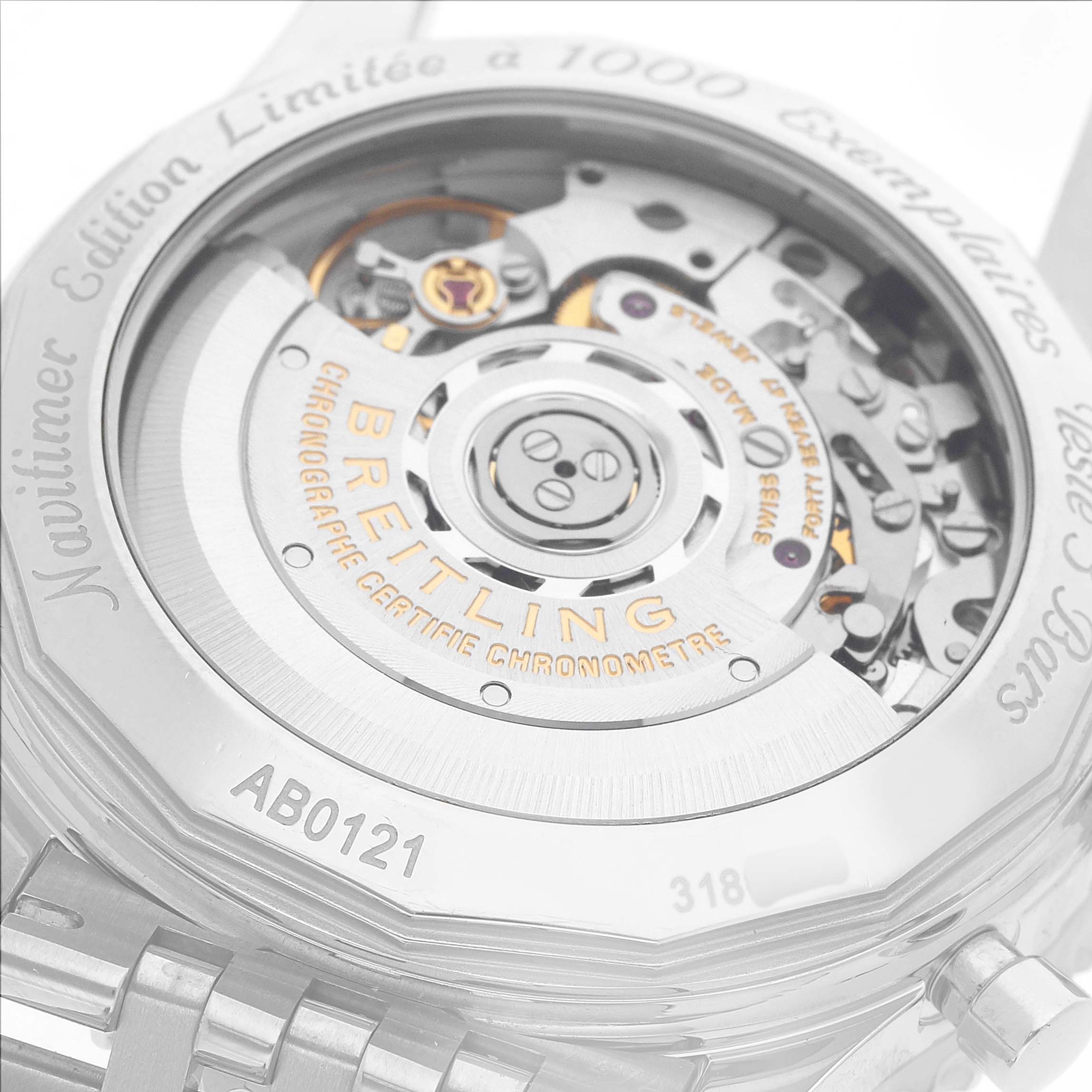 The image shows the back view of a Breitling Navitimer AB0121C4/C920 Men's Stainless Steel Blue Dial watch, focusing on the movement and engraved details.