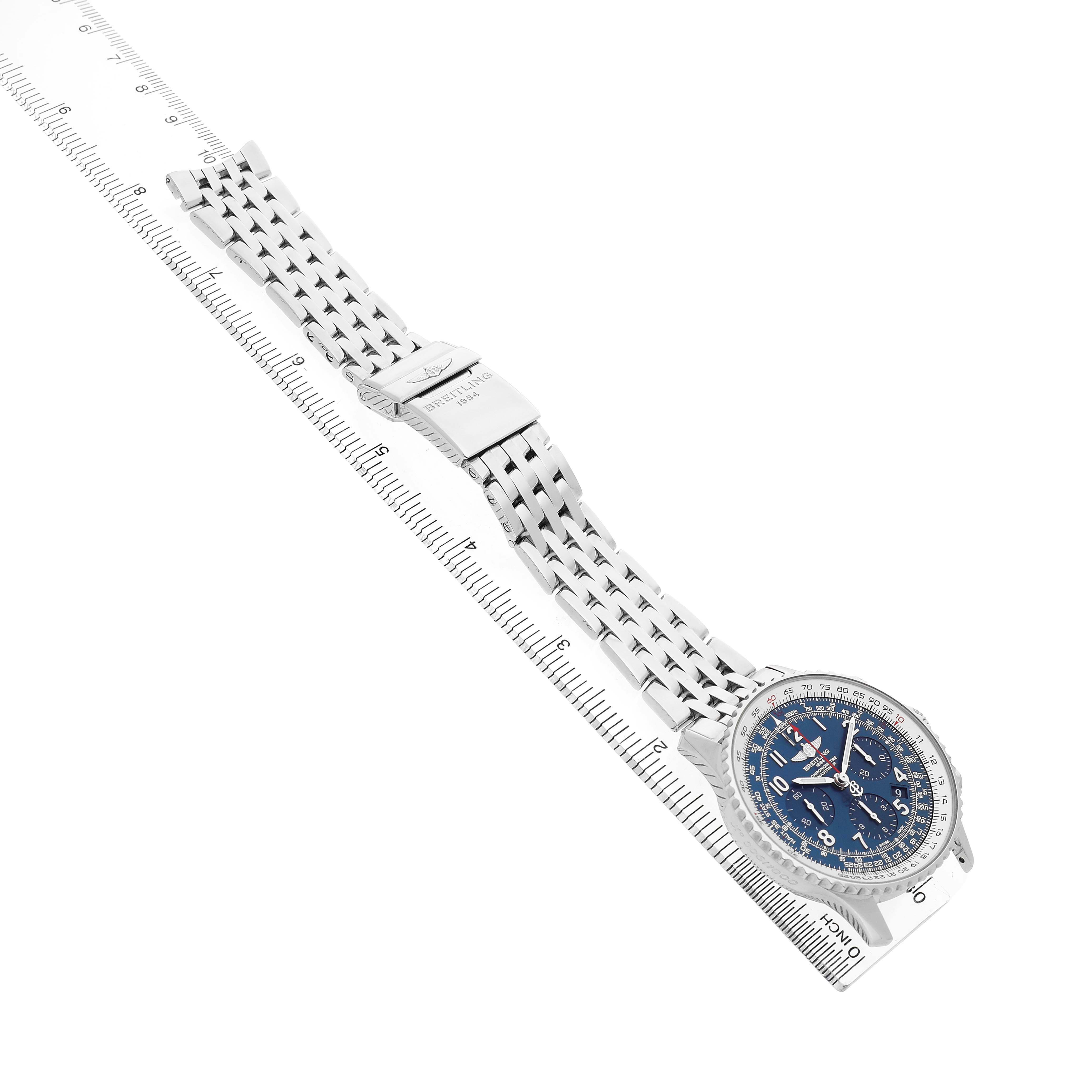 The Breitling Navitimer AB0121C4/C920 Men's Stainless Steel Blue Dial watch is shown at an angled view displaying the face, bracelet, and clasp alongside a measuring ruler.