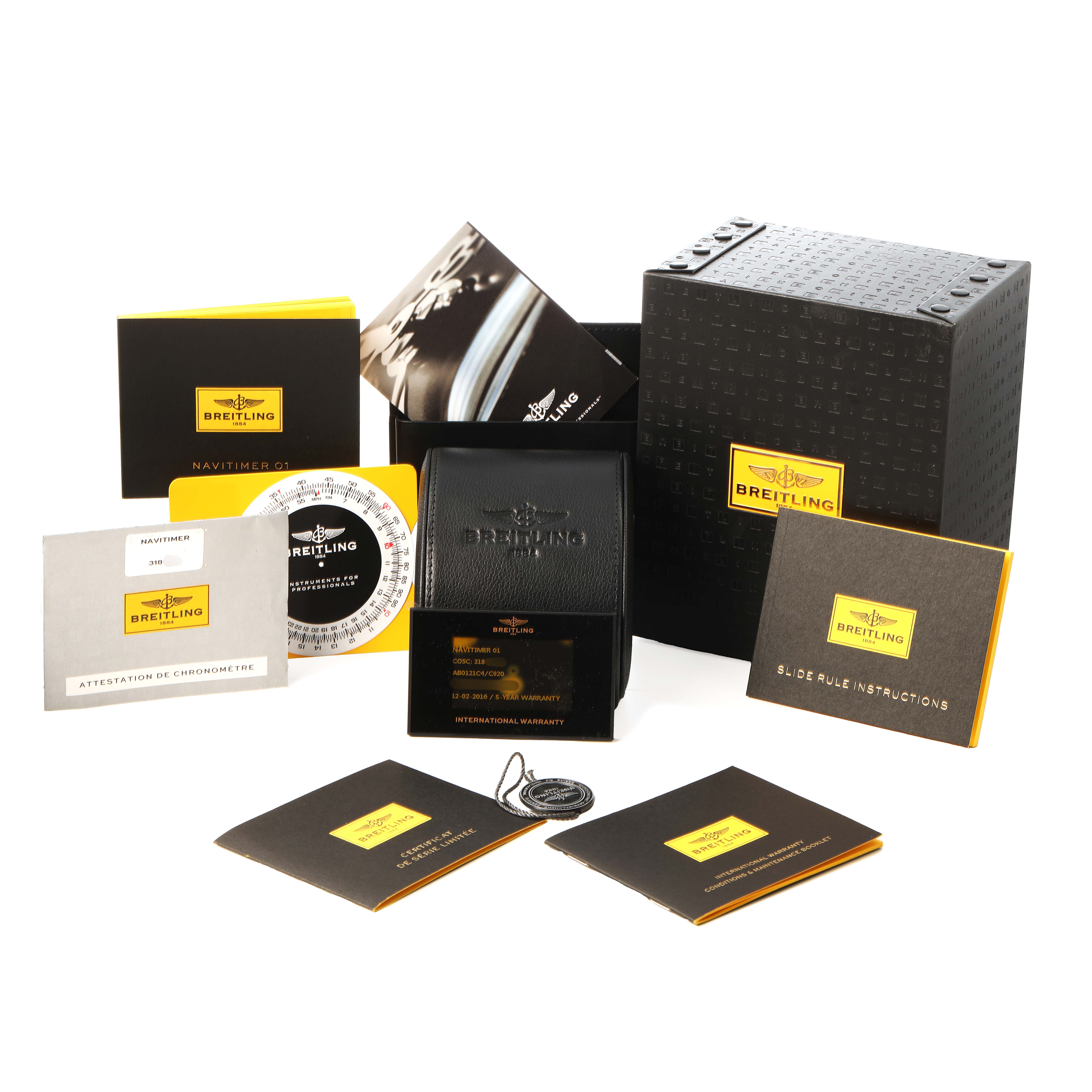 The image shows accessories for the Breitling Navitimer AB0121C4/C920 Men's Stainless Steel Blue Dial, including the box, manual, warranty card, and certification documents.