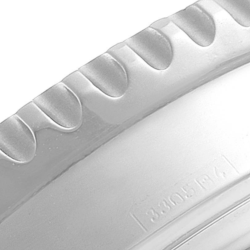 The image shows a close-up of the bezel edge and part of the case of a Breitling Navitimer A23322 Men's Stainless Steel Silver Dial A23322 Men's Stainless Steel Silver Dial watch.