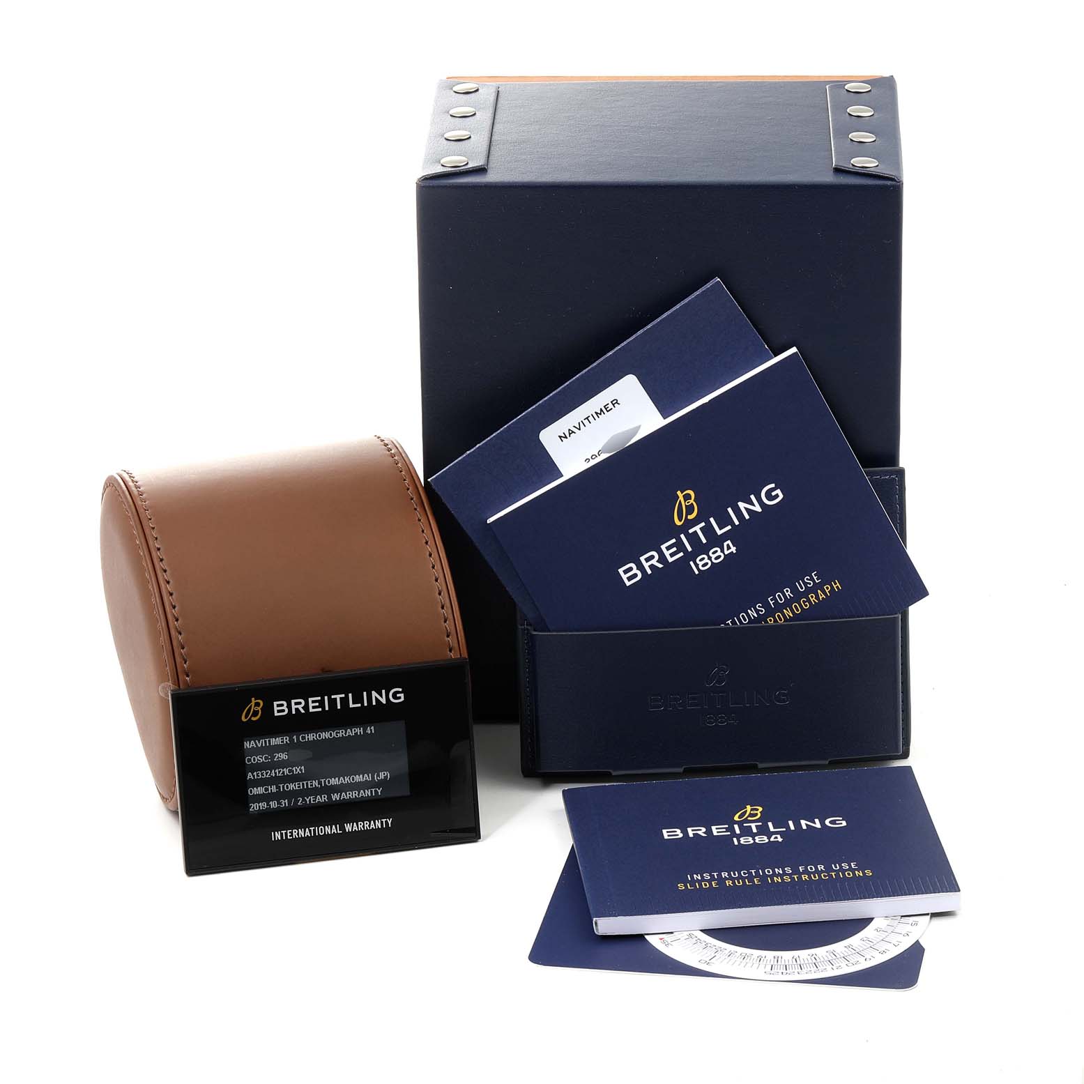 This image shows the packaging, manuals, and warranty card for the Breitling Navitimer A13324 Men
s Stainless Steel Blue Dial A13324 Men
s Stainless Steel Blue Dial watch from a front angle.