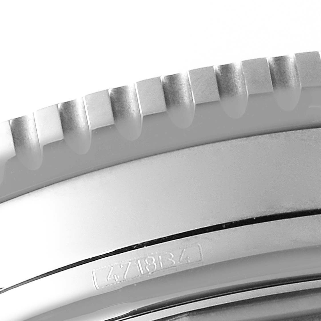 The image shows a close-up of the bezel and part of the case of a Breitling Navitimer A13324 Men
s Stainless Steel Blue Dial A13324 Men
s Stainless Steel Blue Dial watch.