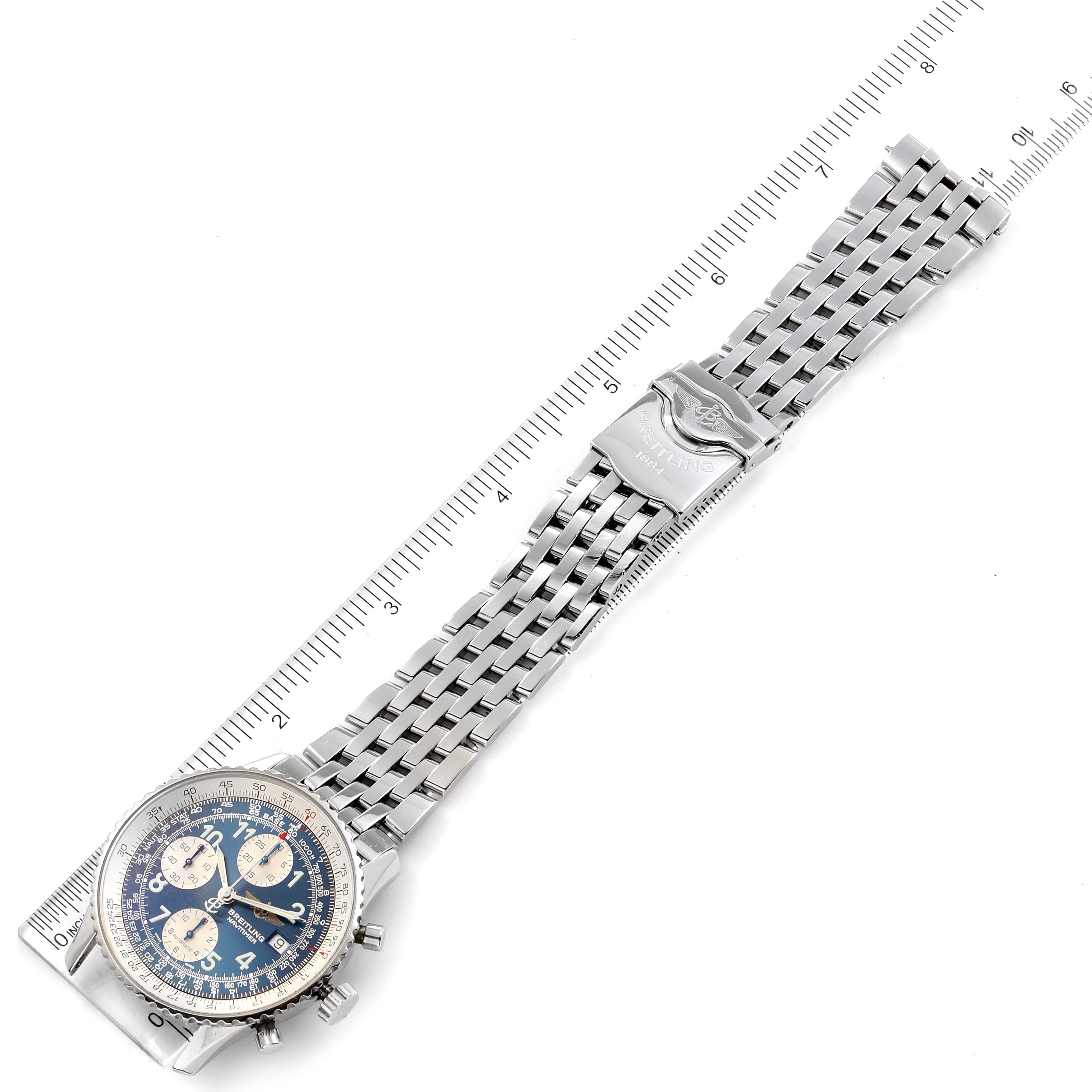 The image shows a Breitling Navitimer A13022 Men
s Stainless Steel Blue Dial A13022 Men
s Stainless Steel Blue Dial watch laid flat with a close-up view of its face, bracelet, and clasp, positioned next to a ruler.