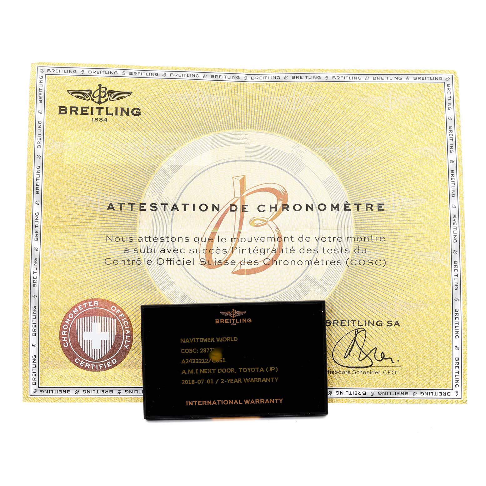 The image shows a Breitling Navitimer A2432212 Men's Stainless Steel Blue Dial A2432212 Men's Stainless Steel Blue Dial model's warranty card and chronometer certification from a top-down angle.