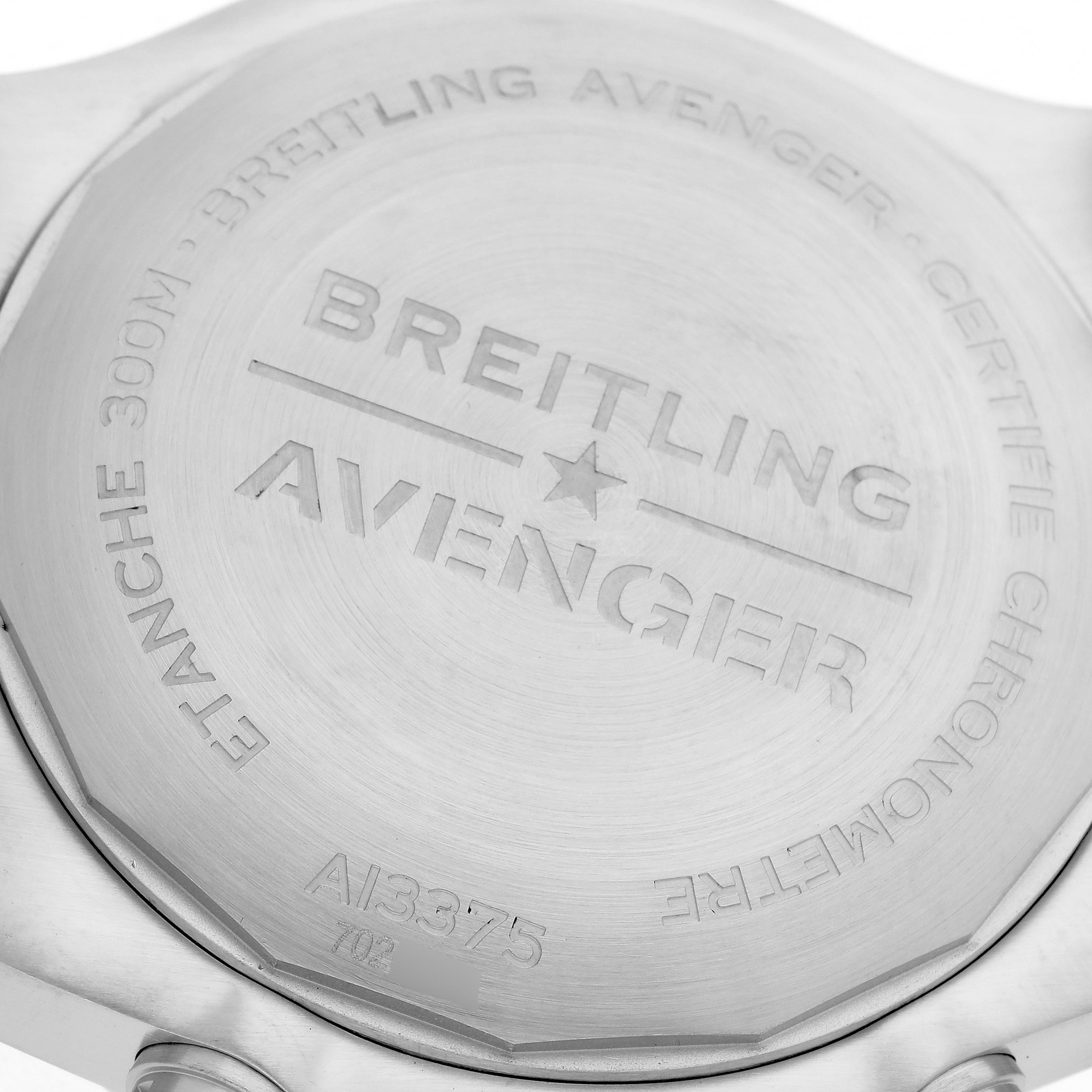 The image shows the back of a Breitling Avenger A13375 Men
s Stainless Steel Black Dial A13375 Men
s Stainless Steel Black Dial watch, featuring engraved branding and model details.