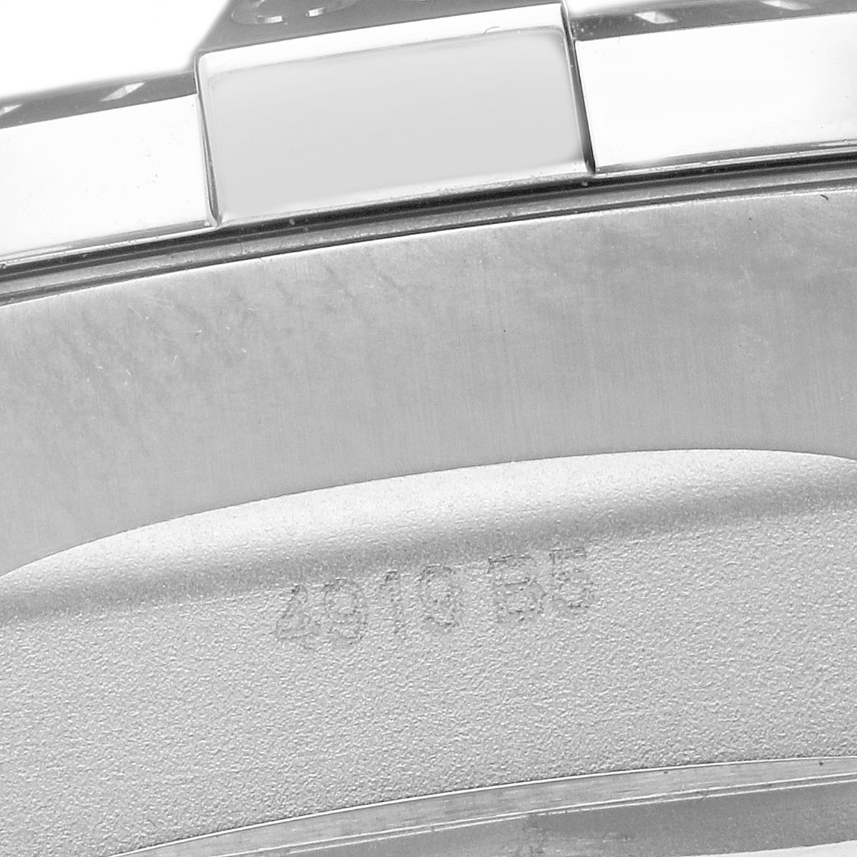 The image shows a close-up of the Breitling Avenger A13375 Men
s Stainless Steel Black Dial A13375 Men
s Stainless Steel Black Dial
s watch clasp and band, focusing on the edge and serial number.