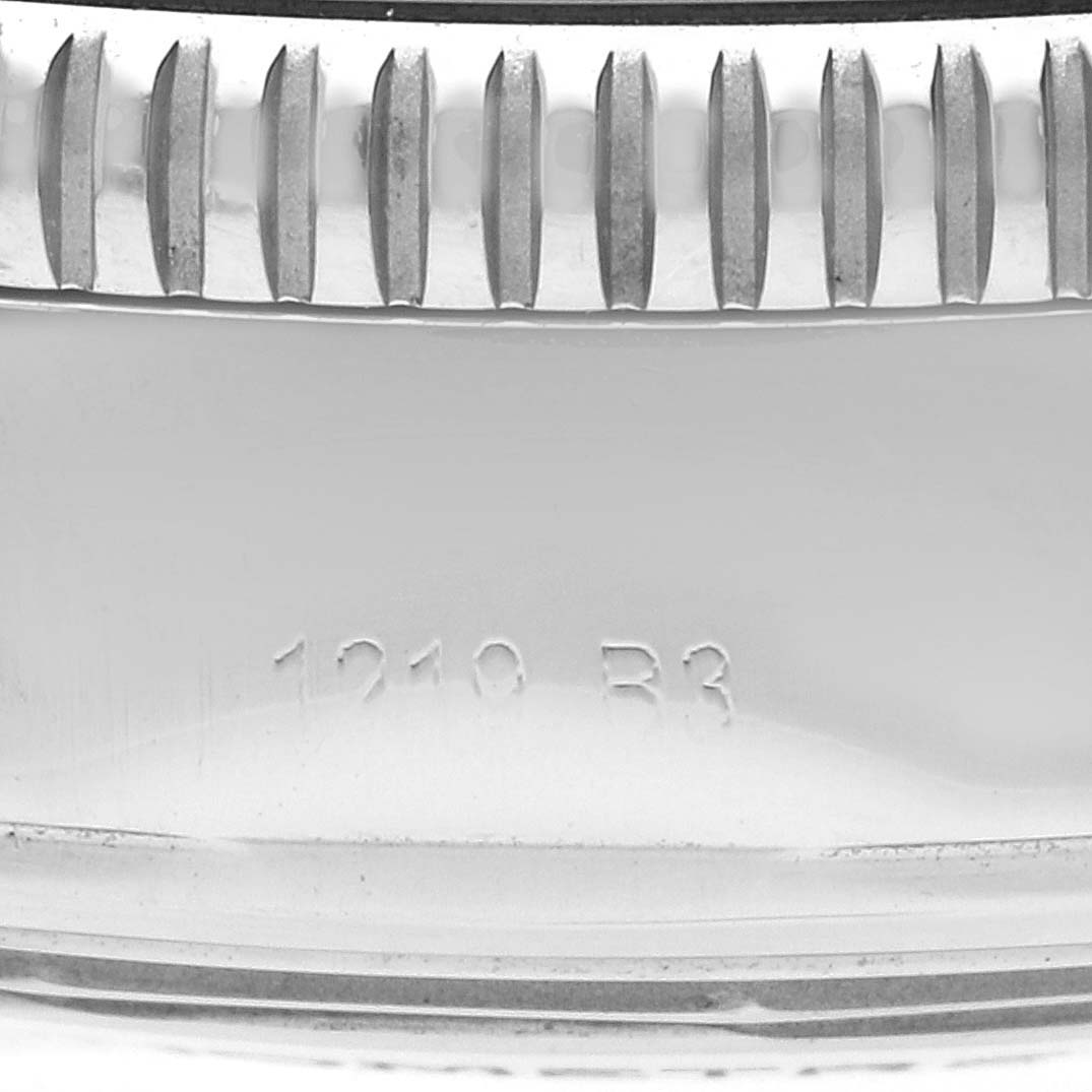 This is a close-up shot of the bezel and serial number engraving on a Breitling Superocean A13313 Men's Stainless Steel Silver Dial A13313 Men's Stainless Steel Silver Dial watch.