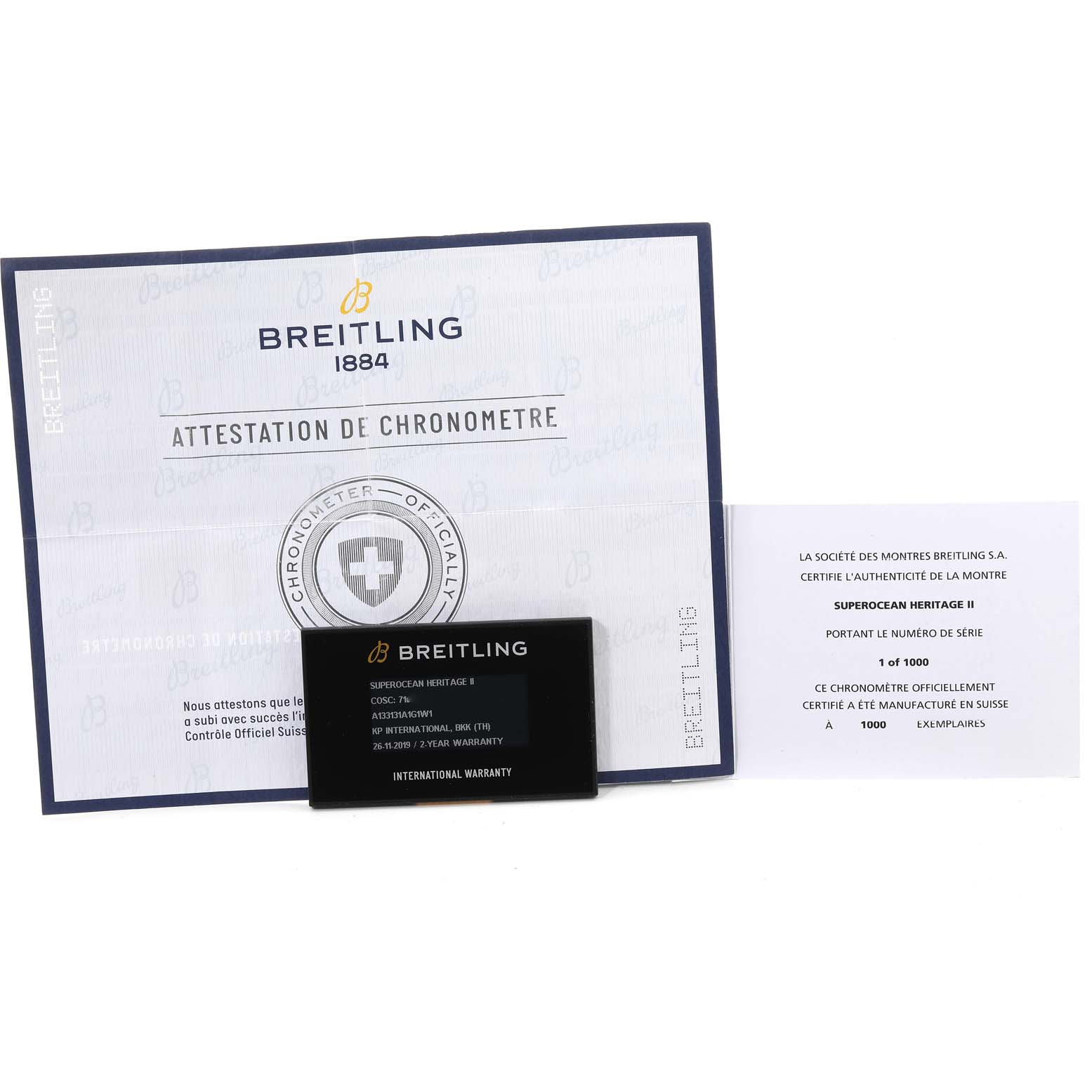 The image shows the chronometer certificate, warranty card, and authenticity card for the Breitling Superocean A13313 Men's Stainless Steel Silver Dial A13313 Men's Stainless Steel Silver Dial model.