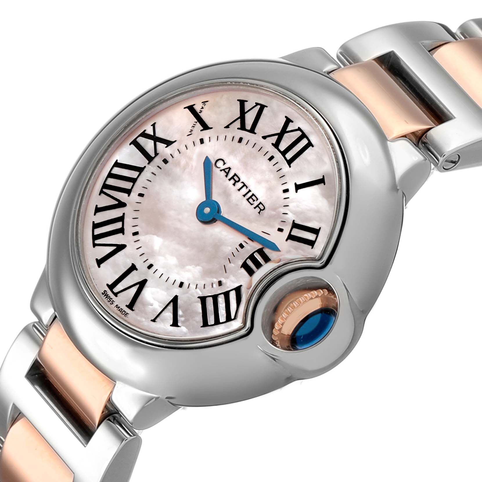 The Cartier Ballon Bleu W6920034 Women's Steel and Gold (two tone) Mother of Pearl Dial watch is shown from a close-up angle, highlighting the face, Roman numerals, and signature crown.