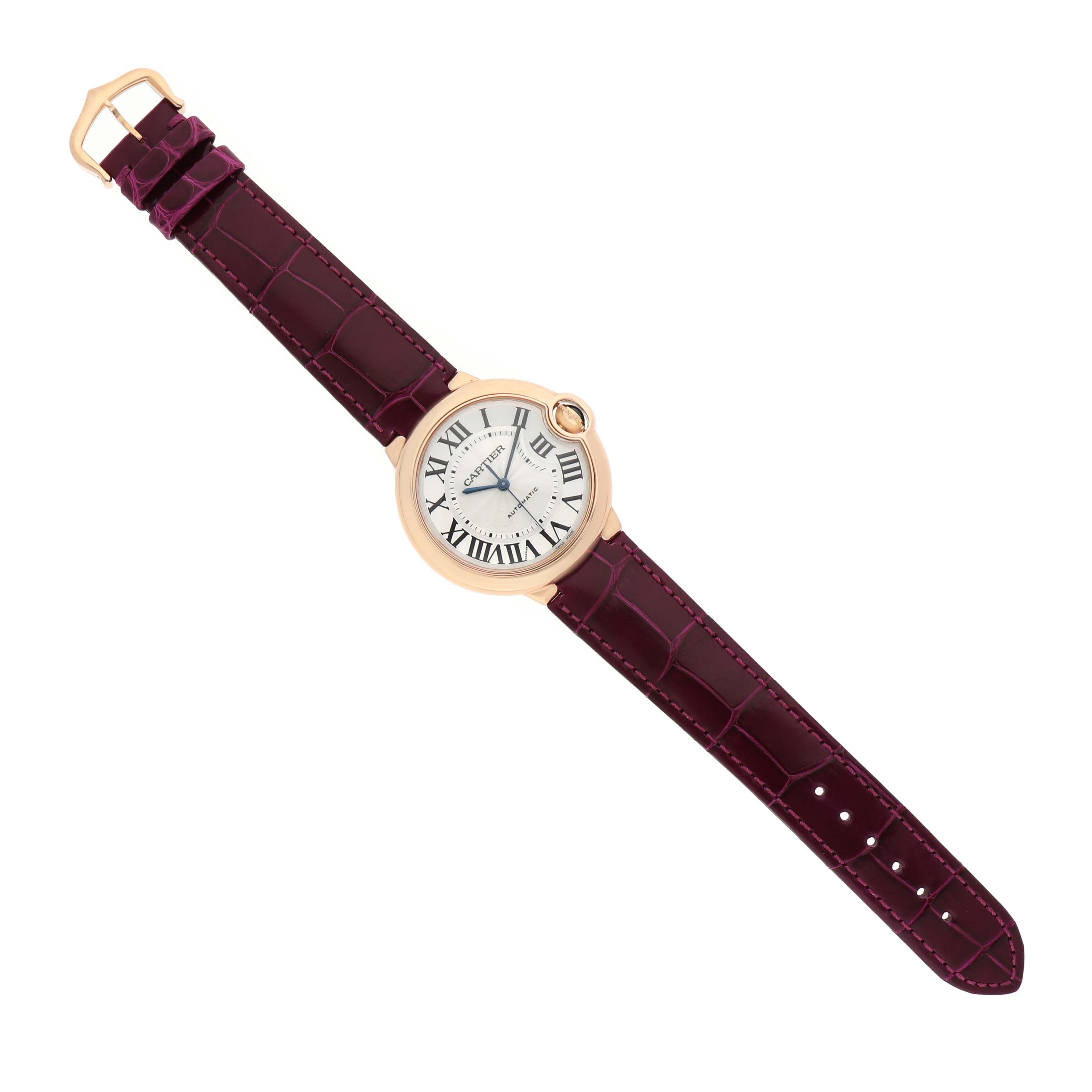 The Cartier Ballon Bleu WGBB0009 Women's Rose Gold Silver Dial watch is shown from a top view, highlighting the face, case, and strap.