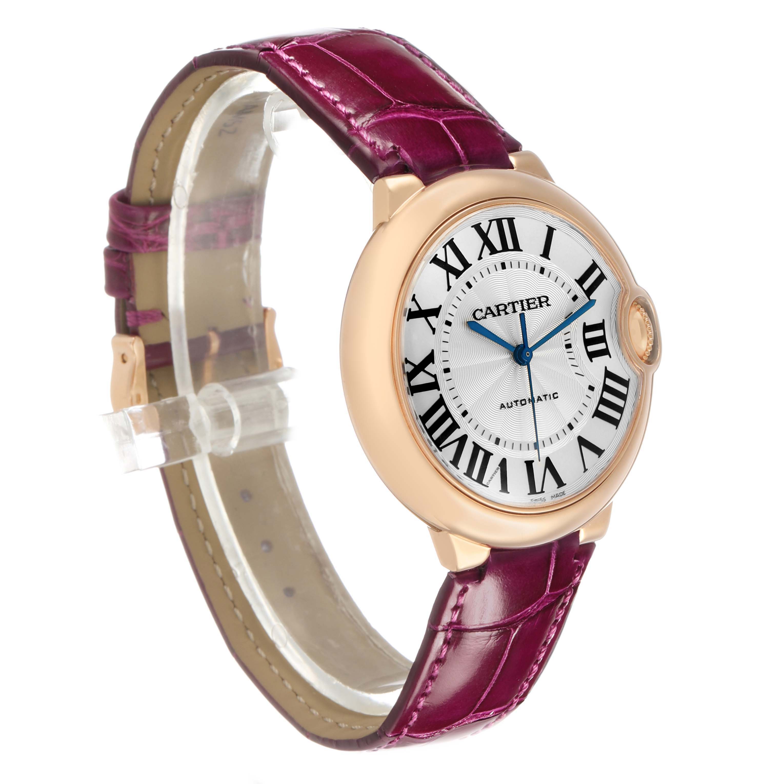 The Cartier Ballon Bleu WGBB0009 Women's Rose Gold Silver Dial watch is shown at a three-quarter angle, displaying the face, round case, crown, and purple leather strap.