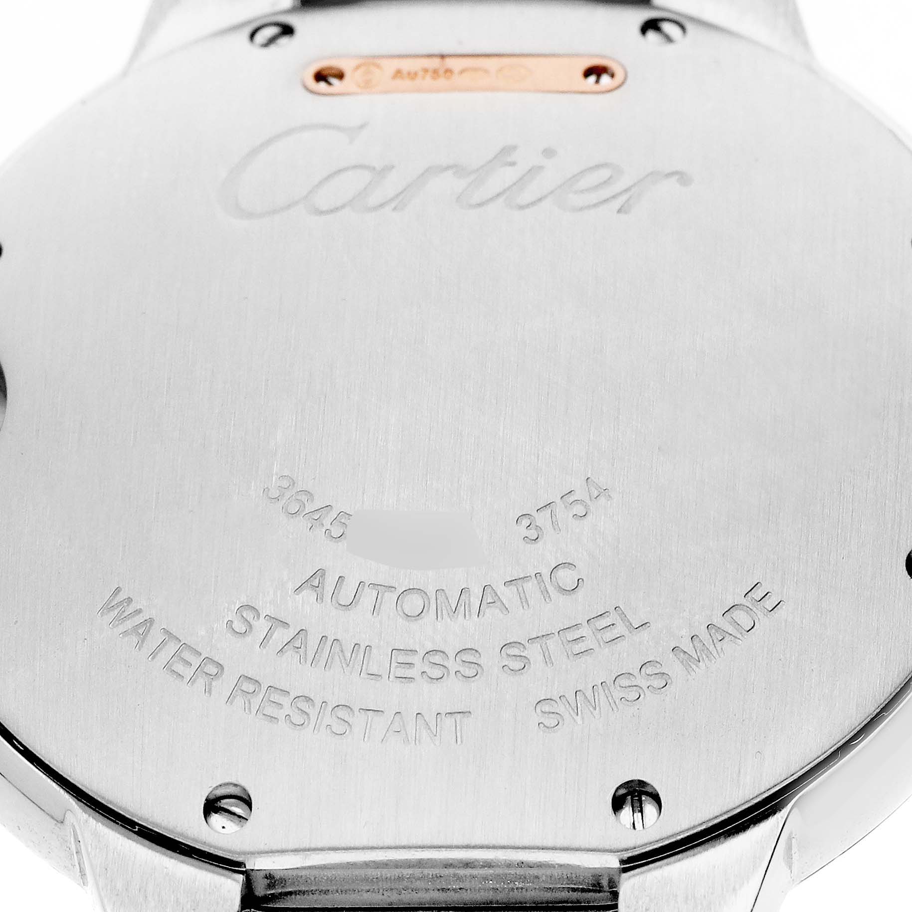 The image shows the back of a Cartier Ballon Bleu W3BB0004 Women's Steel and Gold (two tone) Silver Dial watch, highlighting the engravings and metal details.