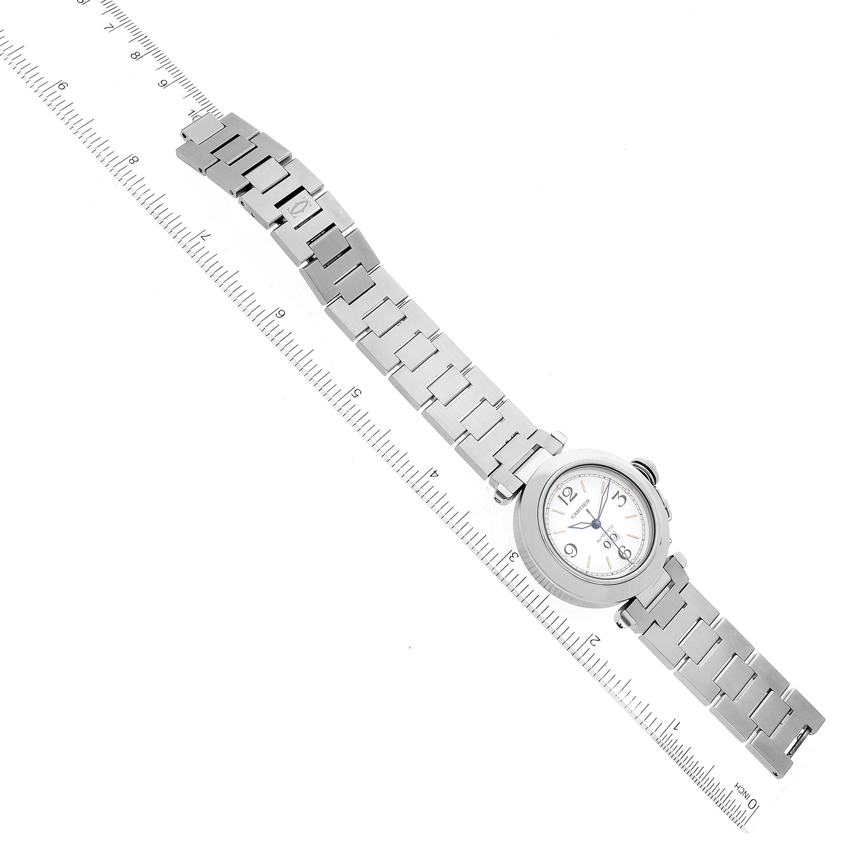 The image shows a Cartier Pasha W31044M7 Men's Stainless Steel White Dial W31044M7 Men's Stainless Steel White Dial watch laid flat with both the face and bracelet visible, measured against a ruler.