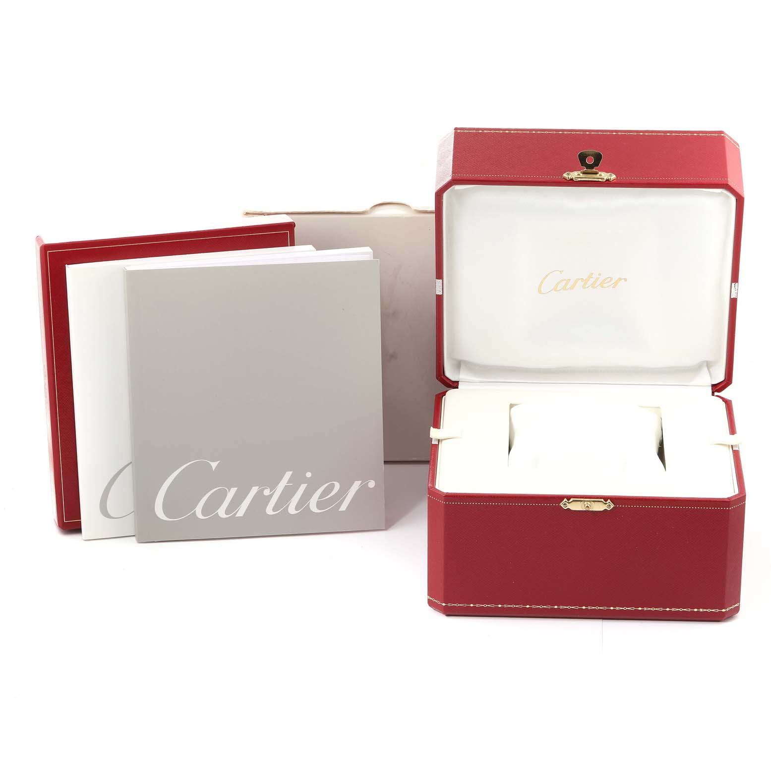 The image shows the packaging and box accessories for a Cartier Roadster W62025V3 Men's Stainless Steel Silver Dial W62025V3 Men's Stainless Steel Silver Dial watch, including manuals and a presentation box.