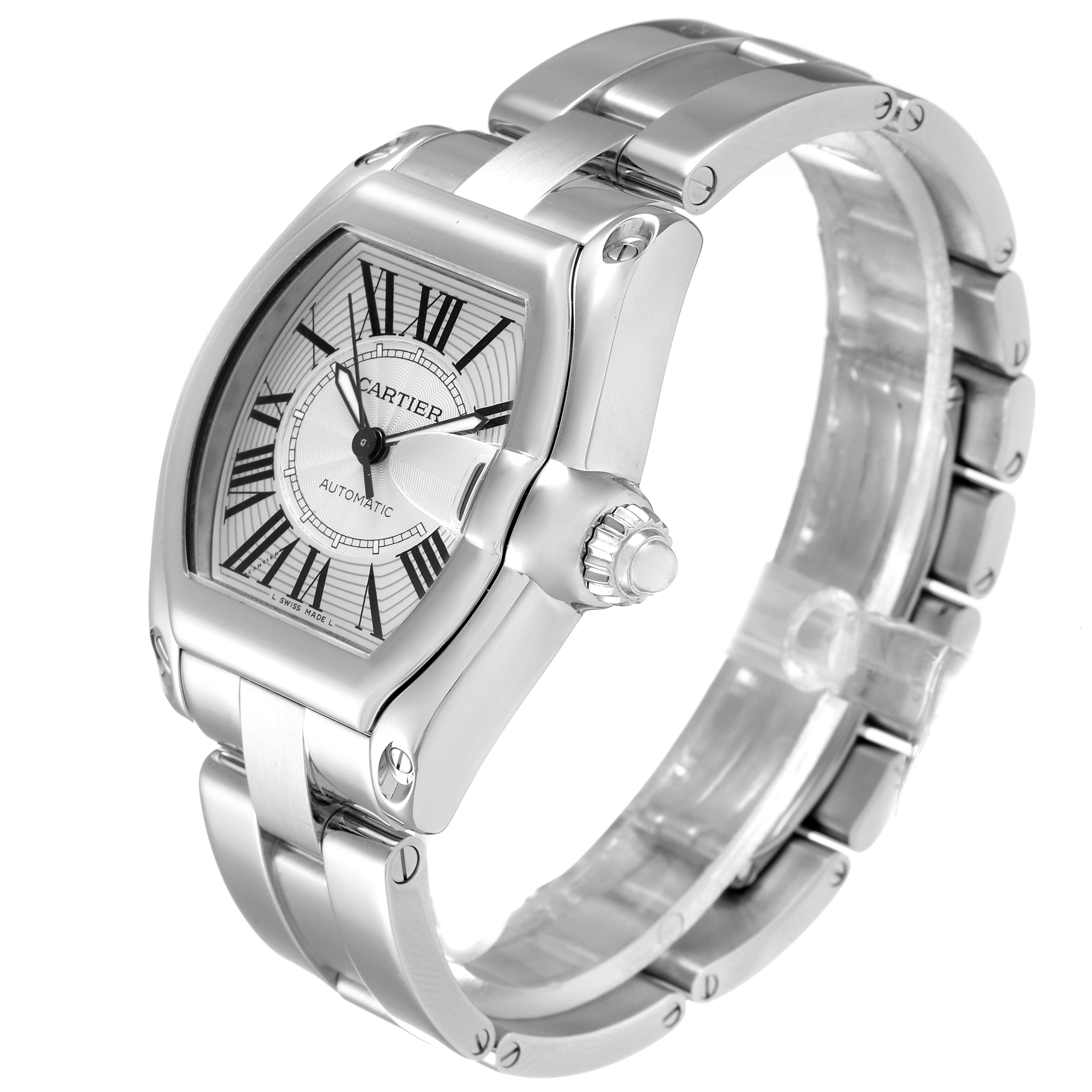 The image shows a Cartier Roadster W62025V3 Men
s Stainless Steel Silver Dial W62025V3 Men
s Stainless Steel Silver Dial watch at a 3/4 angle, displaying its face, crown, and metal bracelet.