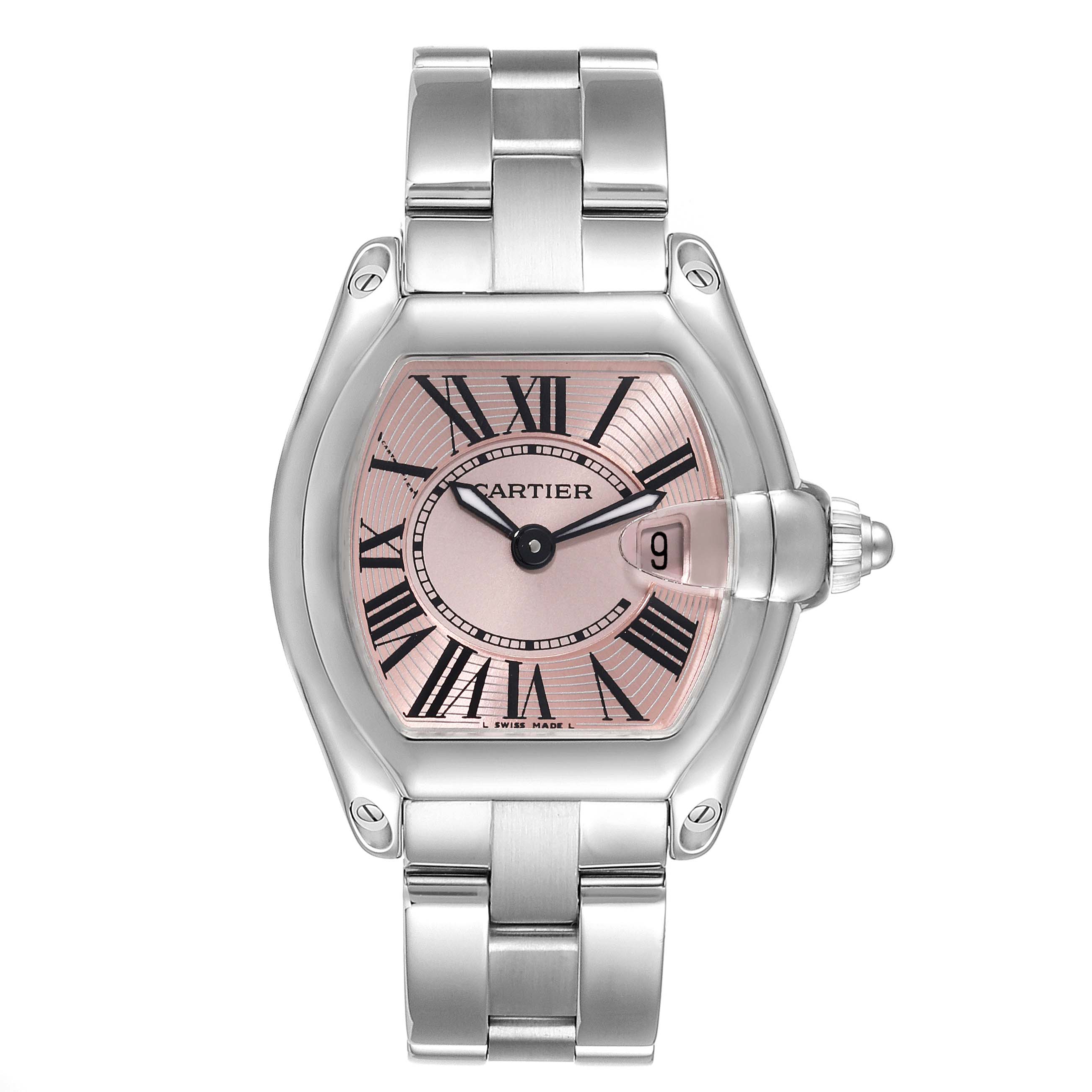 The image shows a frontal view of the Cartier Roadster W62017V3 Women's Stainless Steel Pink Dial W62017V3 Women's Stainless Steel Pink Dial model watch, highlighting its pink dial, Roman numerals, and metal bracelet.