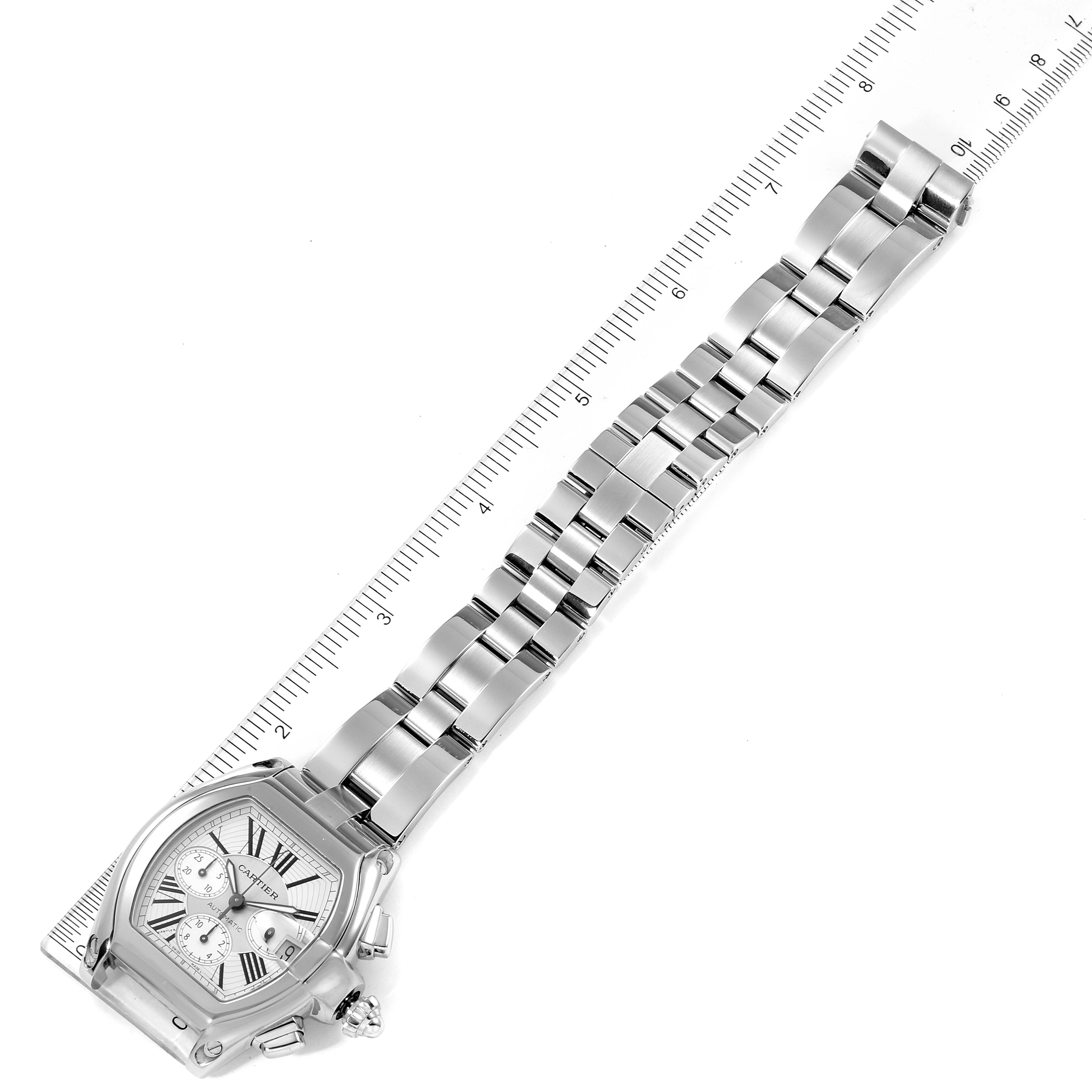 The Cartier Roadster W62019X6 Men's Stainless Steel Silver Dial W62019X6 Men's Stainless Steel Silver Dial watch is shown positioned diagonally, highlighting its silver bracelet and detailed face.