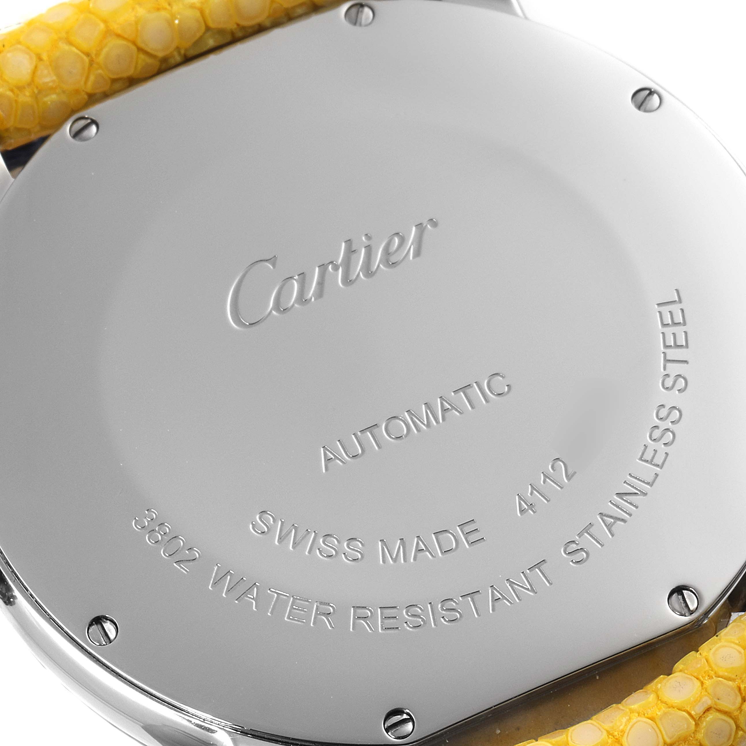 This image shows the back case of a Cartier Tank Solo WSRN0023 Men's Stainless Steel Blue Dial WSRN0023 Men's Stainless Steel Blue Dial watch with detailed engravings and part of the yellow strap.