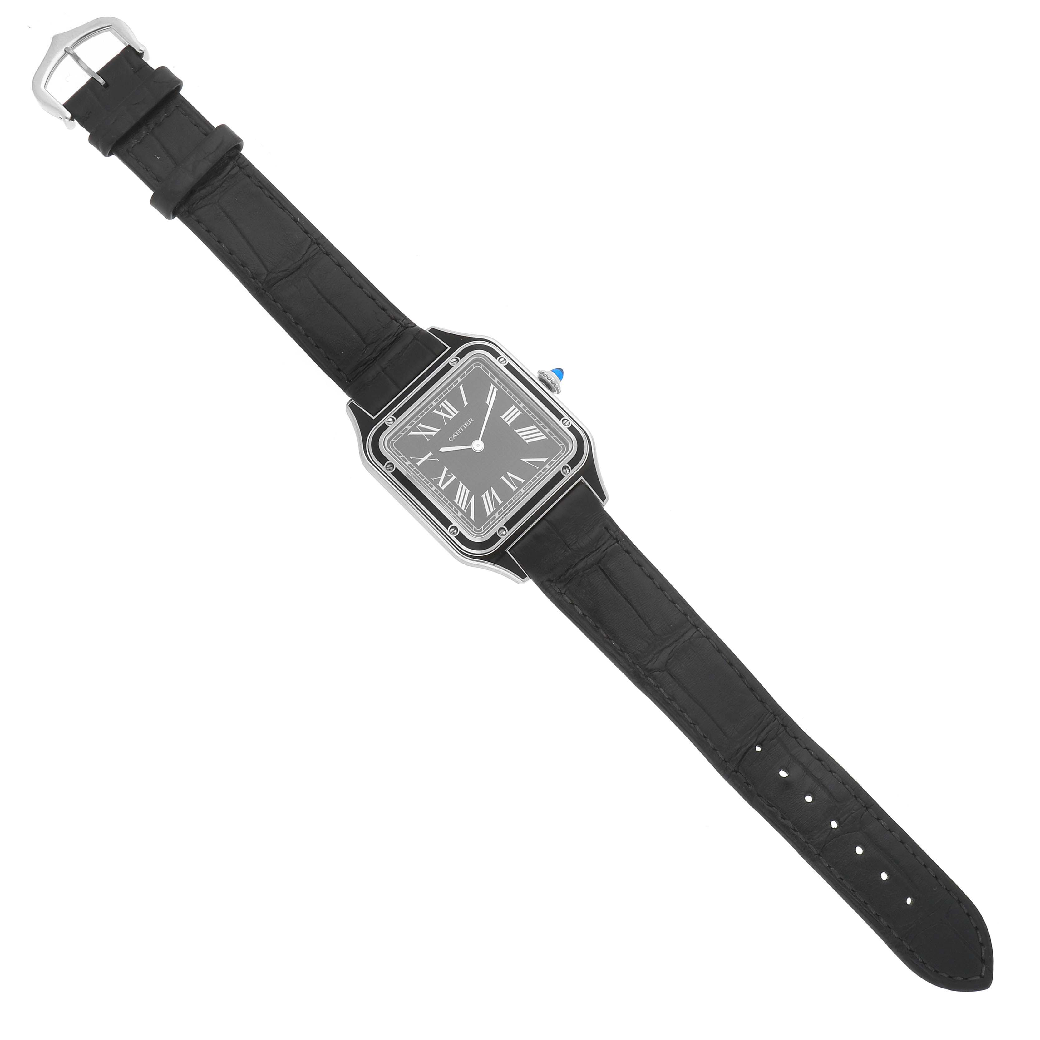 The Cartier Santos WSSA0046 Women's Stainless Steel Black Dial watch is shown from a top-down angle, featuring its square face, Roman numerals, and black leather strap.