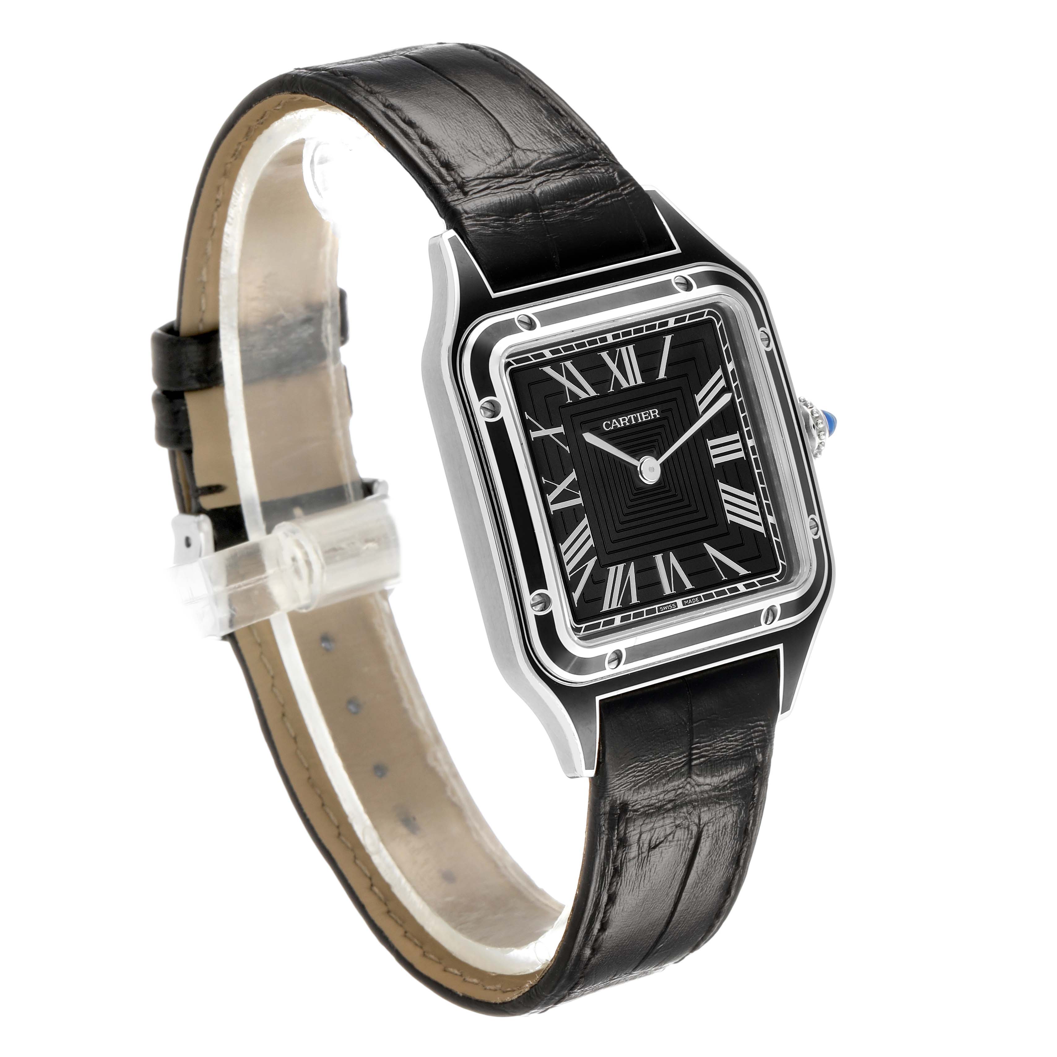 The Cartier Santos WSSA0046 Women's Stainless Steel Black Dial watch is shown at an angled side view, displaying the black dial, Roman numerals, and black leather strap.